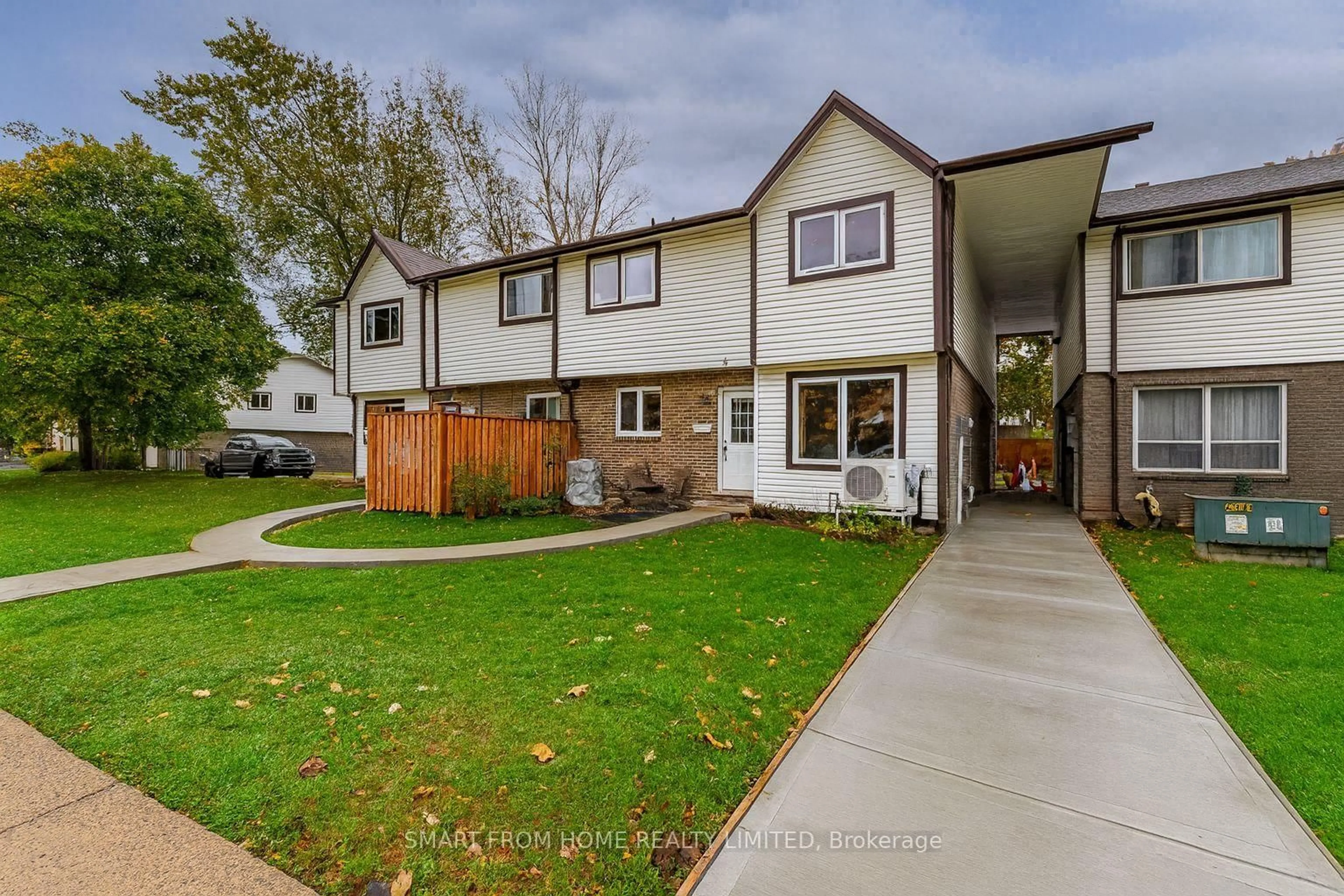A pic from outside/outdoor area/front of a property/back of a property/a pic from drone, street for 445 Pioneer Dr #4, Kitchener Ontario N2P 1L8