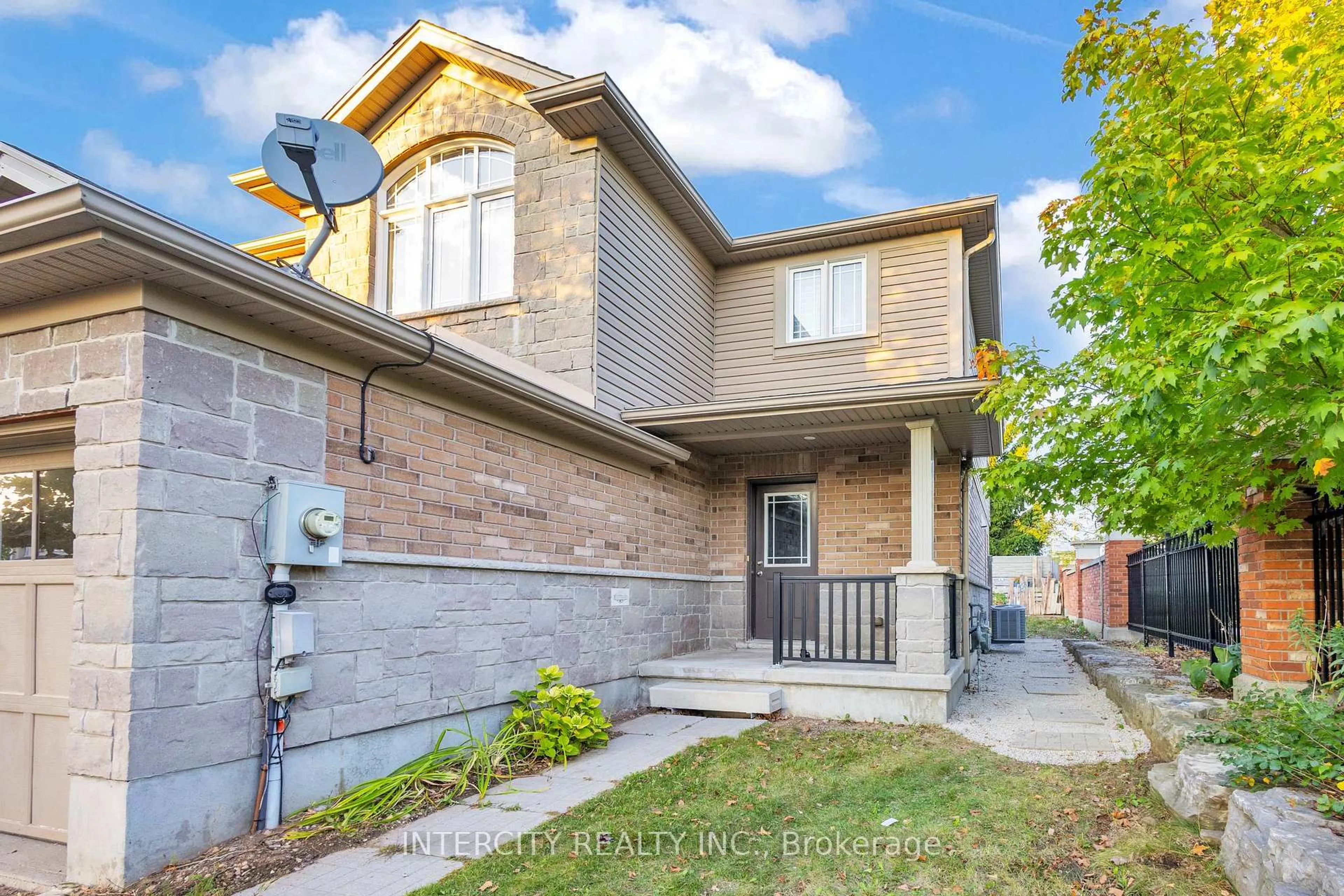 Home with brick exterior material, street for 51 Laughland Lane, Guelph Ontario N1L 0C9