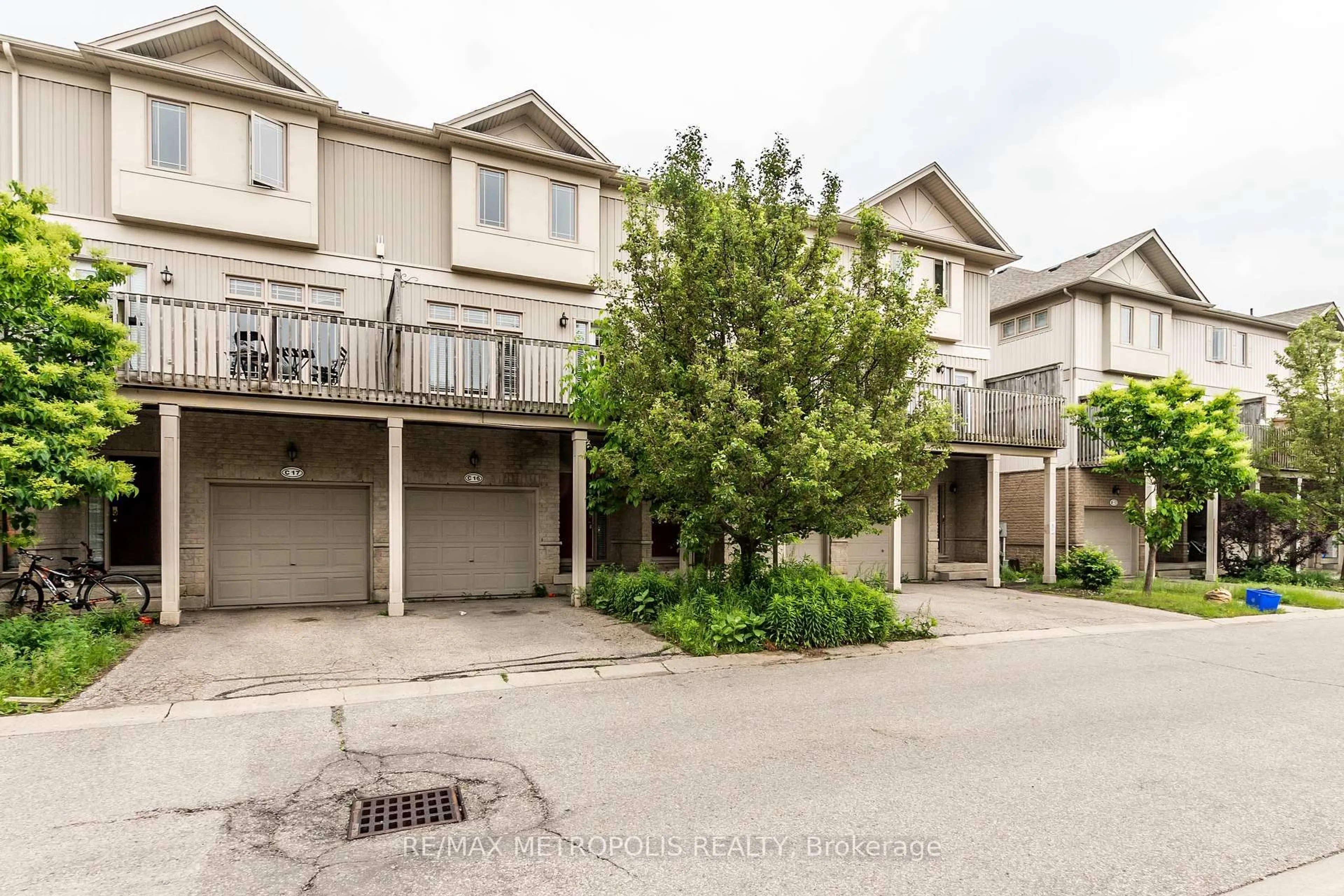 A pic from outside/outdoor area/front of a property/back of a property/a pic from drone, street for 619 Wild Ginger Ave #C16, Waterloo Ontario N2V 2X1