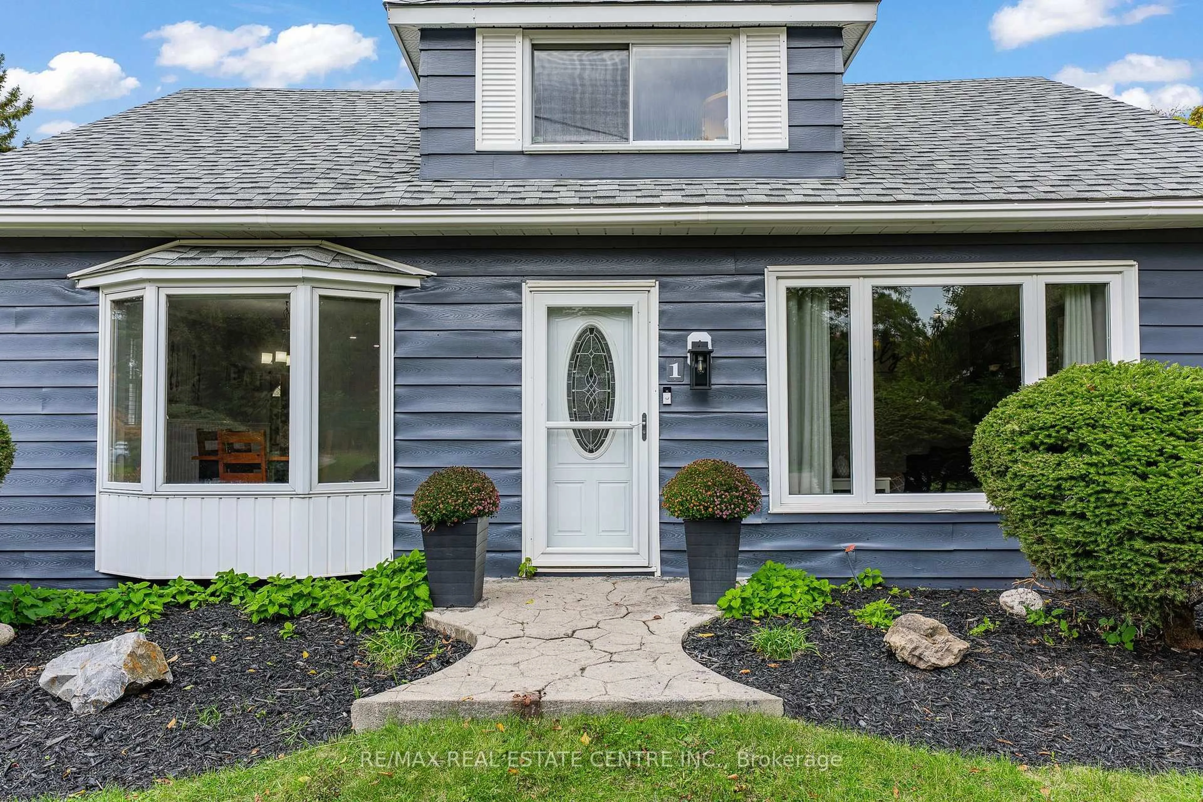 Home with vinyl exterior material, street for 1 Hughson St, North Dumfries Ontario N0B 1L0