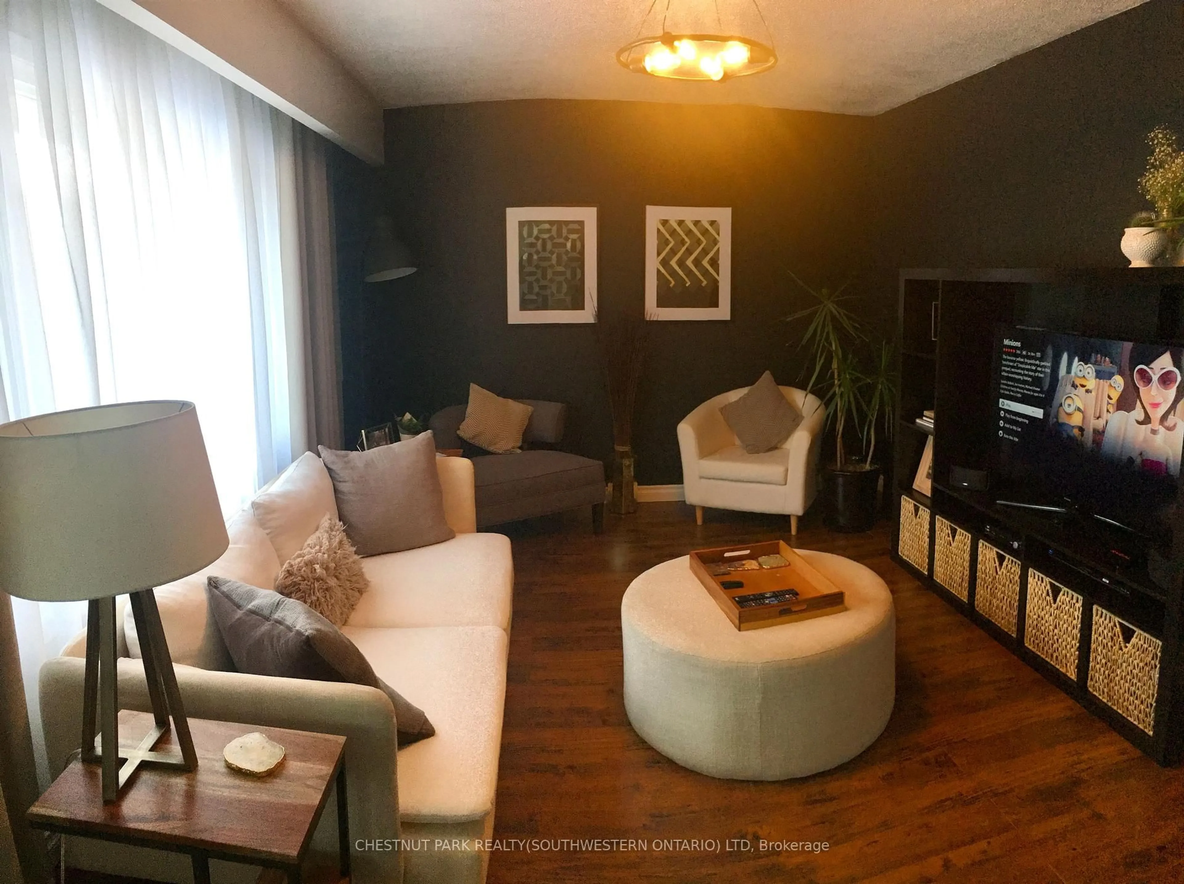 Living room with furniture, wood/laminate floor for 148 Green Valley Dr, Kitchener Ontario N2P 1C4