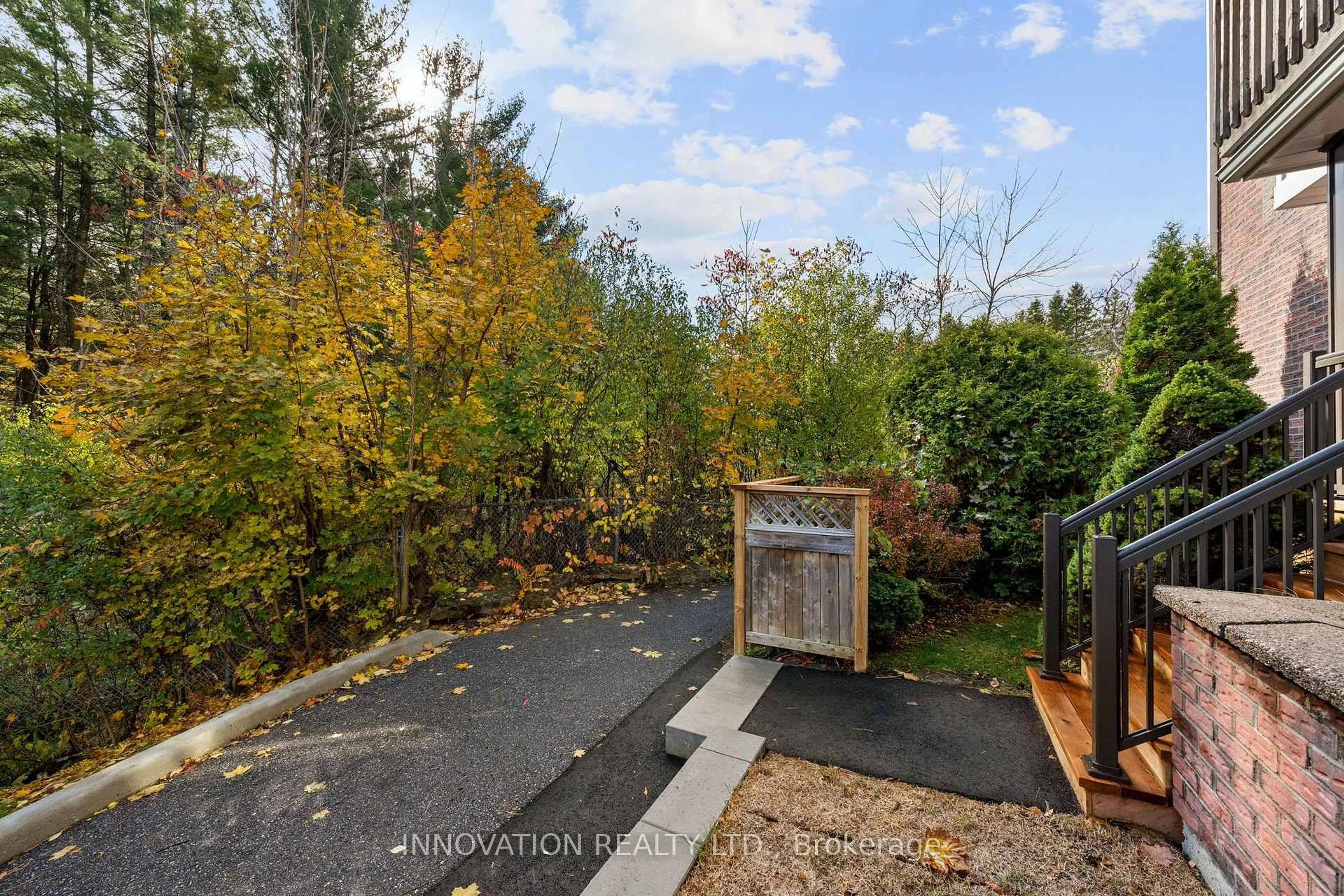 A pic from outside/outdoor area/front of a property/back of a property/a pic from drone, forest/trees view for 5 Timberview Way #8, Ottawa Ontario K2H 9M6