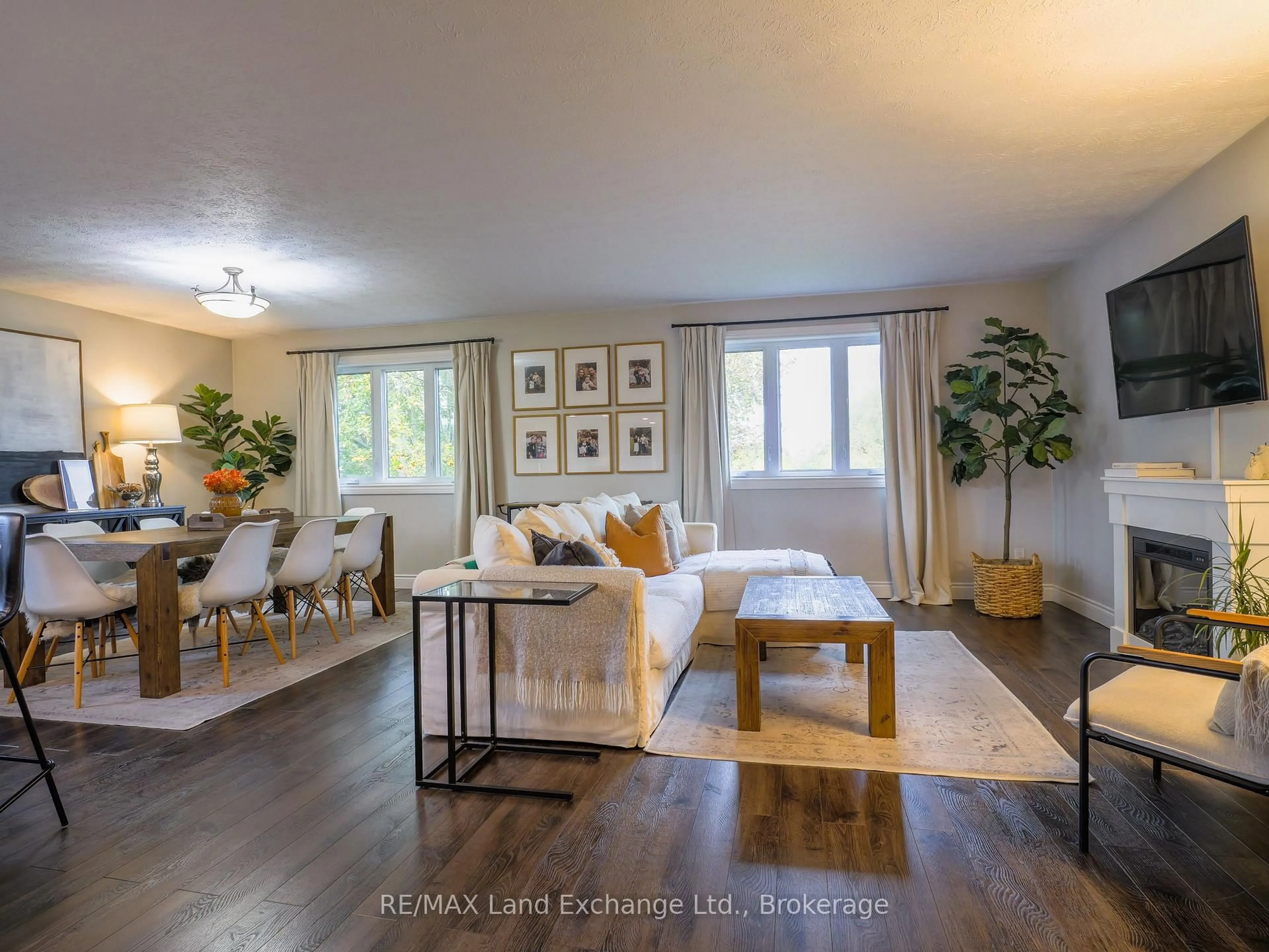 Living room with furniture, wood/laminate floor for 829 Highland St, Saugeen Shores Ontario N0H 2C2