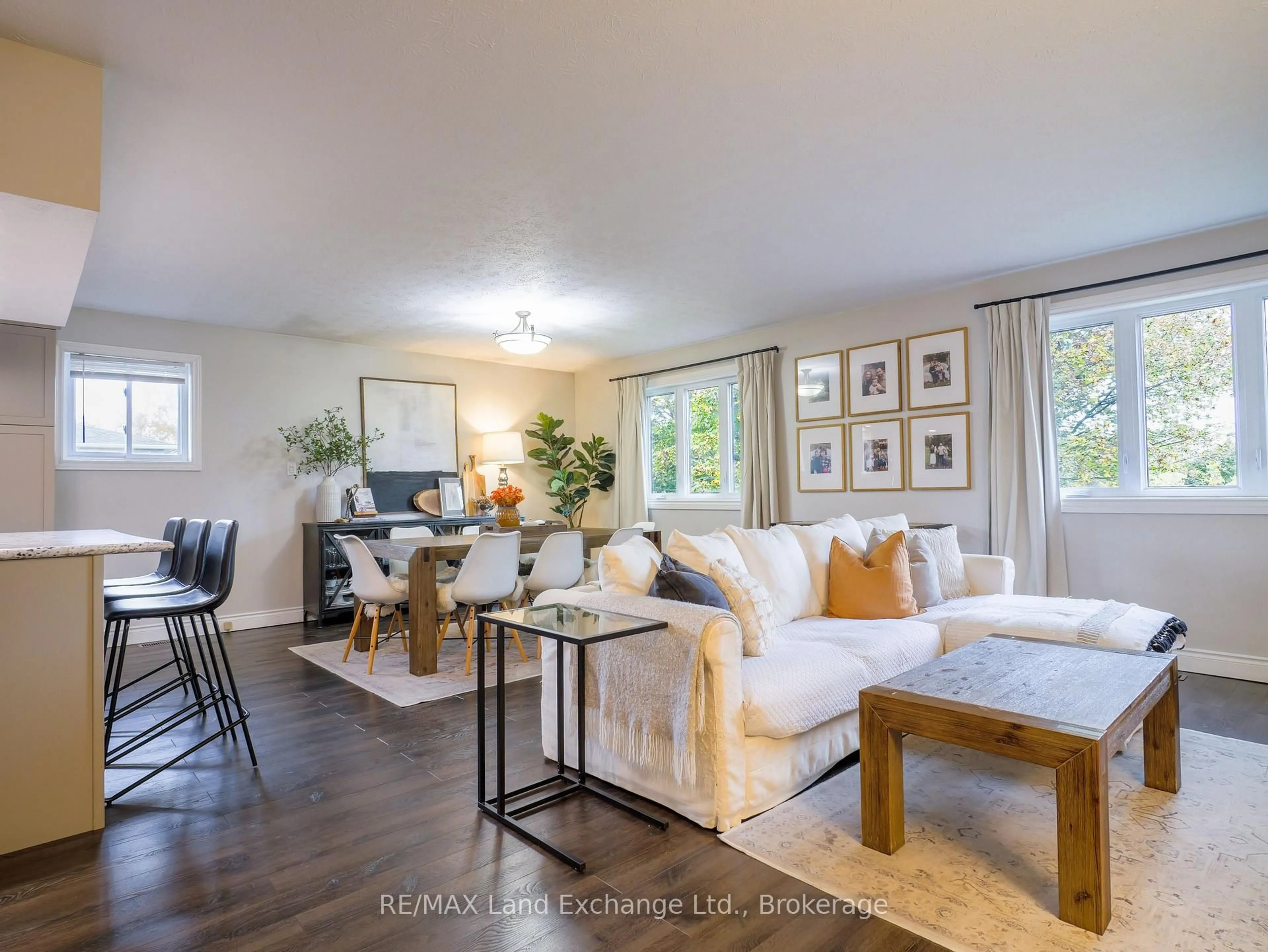 Living room with furniture, wood/laminate floor for 829 Highland St, Saugeen Shores Ontario N0H 2C2