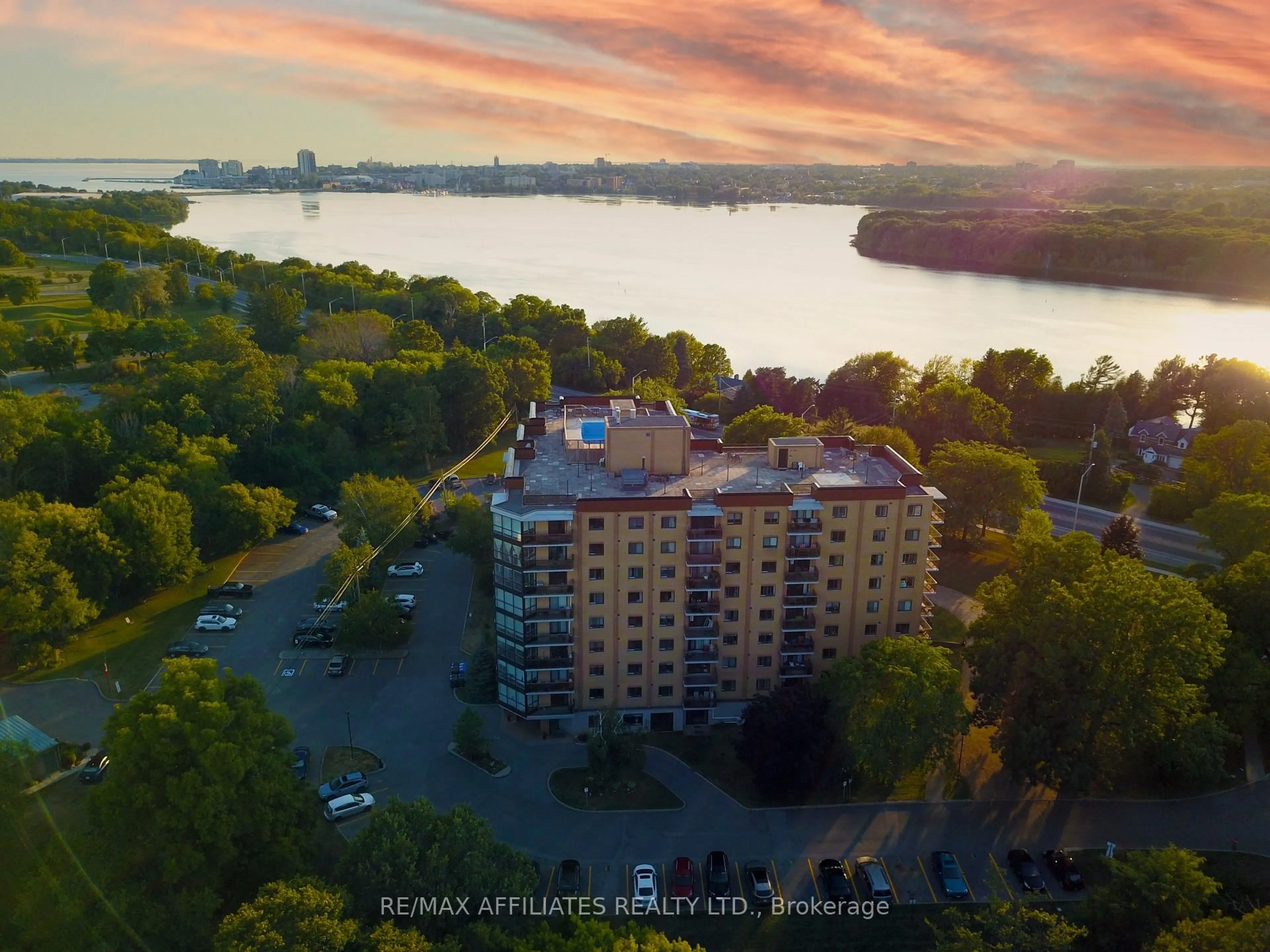 A pic from outside/outdoor area/front of a property/back of a property/a pic from drone, water/lake/river/ocean view for 120 Barrett Crt #309, Kingston Ontario K7L 5H6