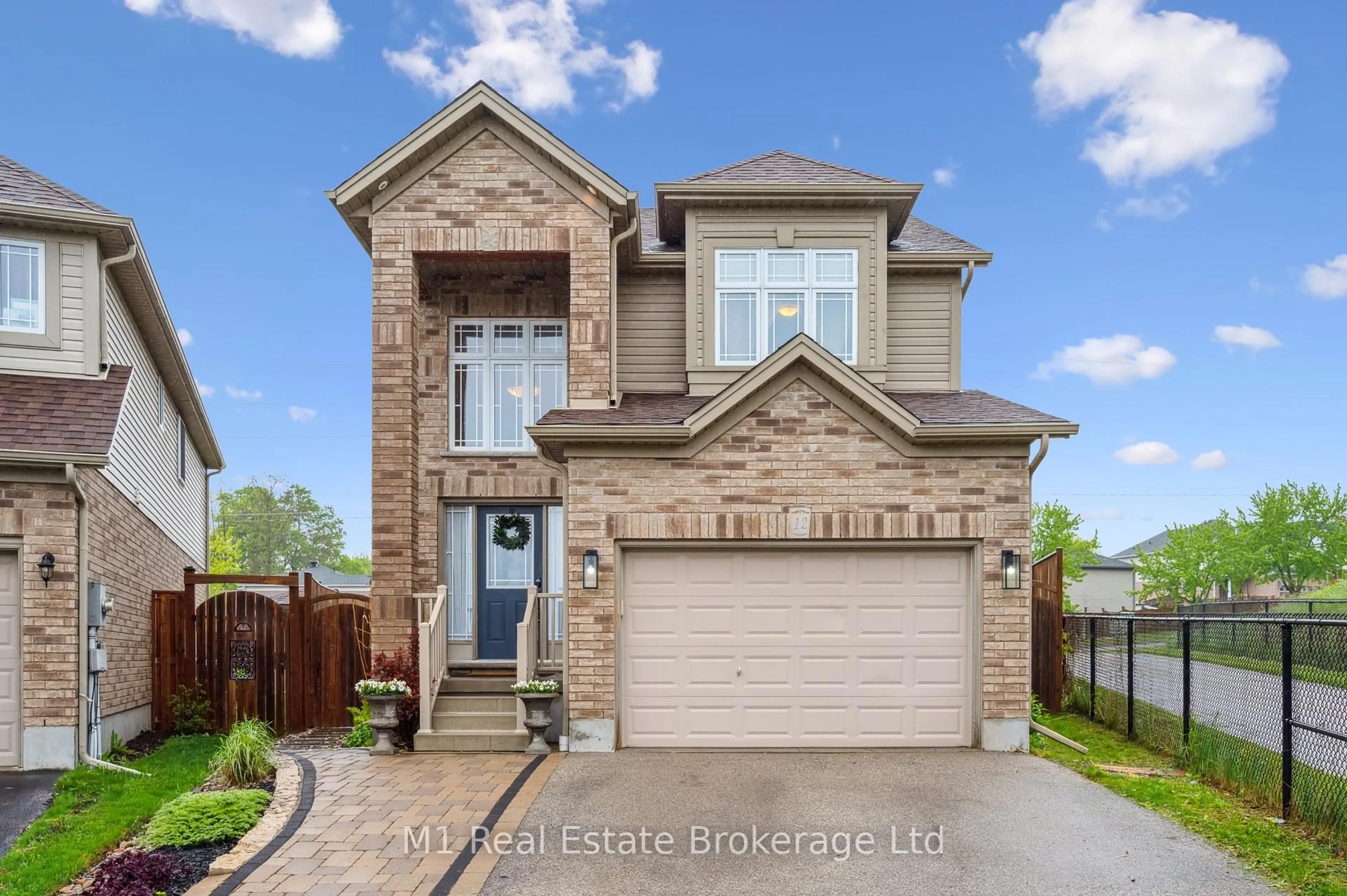 Home with brick exterior material, street for 12 Oakes Crt, Guelph Ontario N1E 0J6