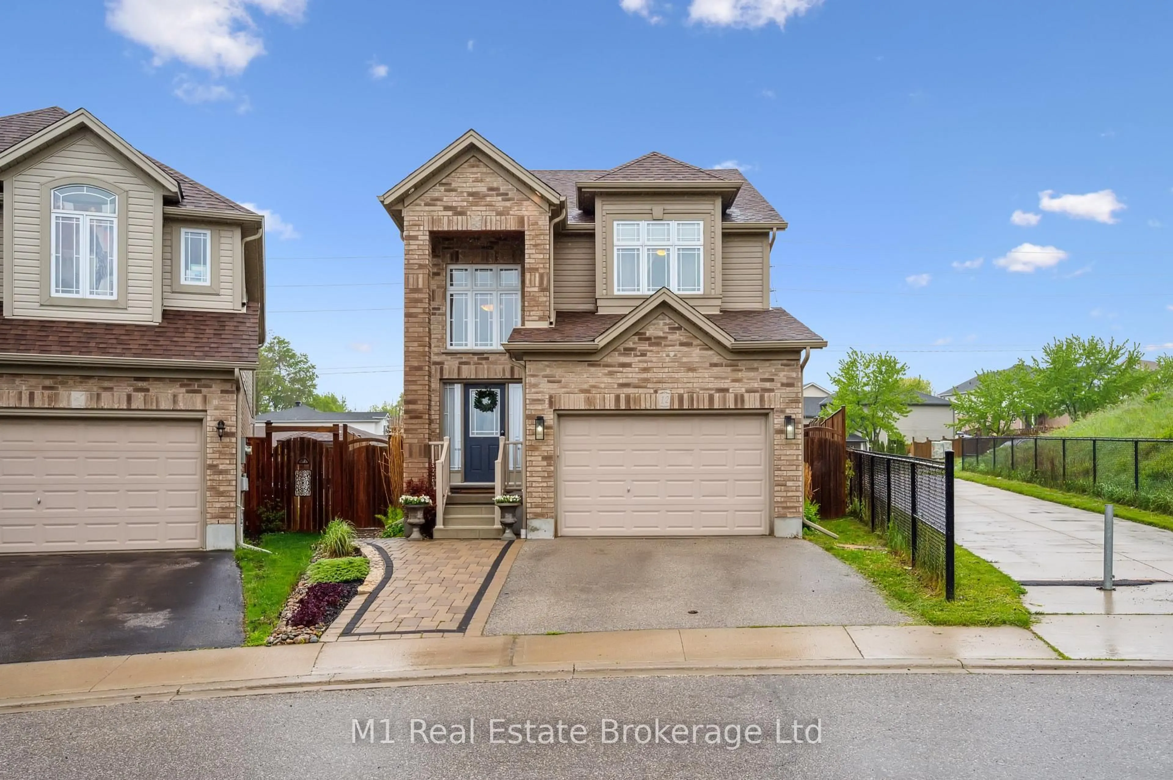 Home with brick exterior material, street for 12 Oakes Crt, Guelph Ontario N1E 0J6