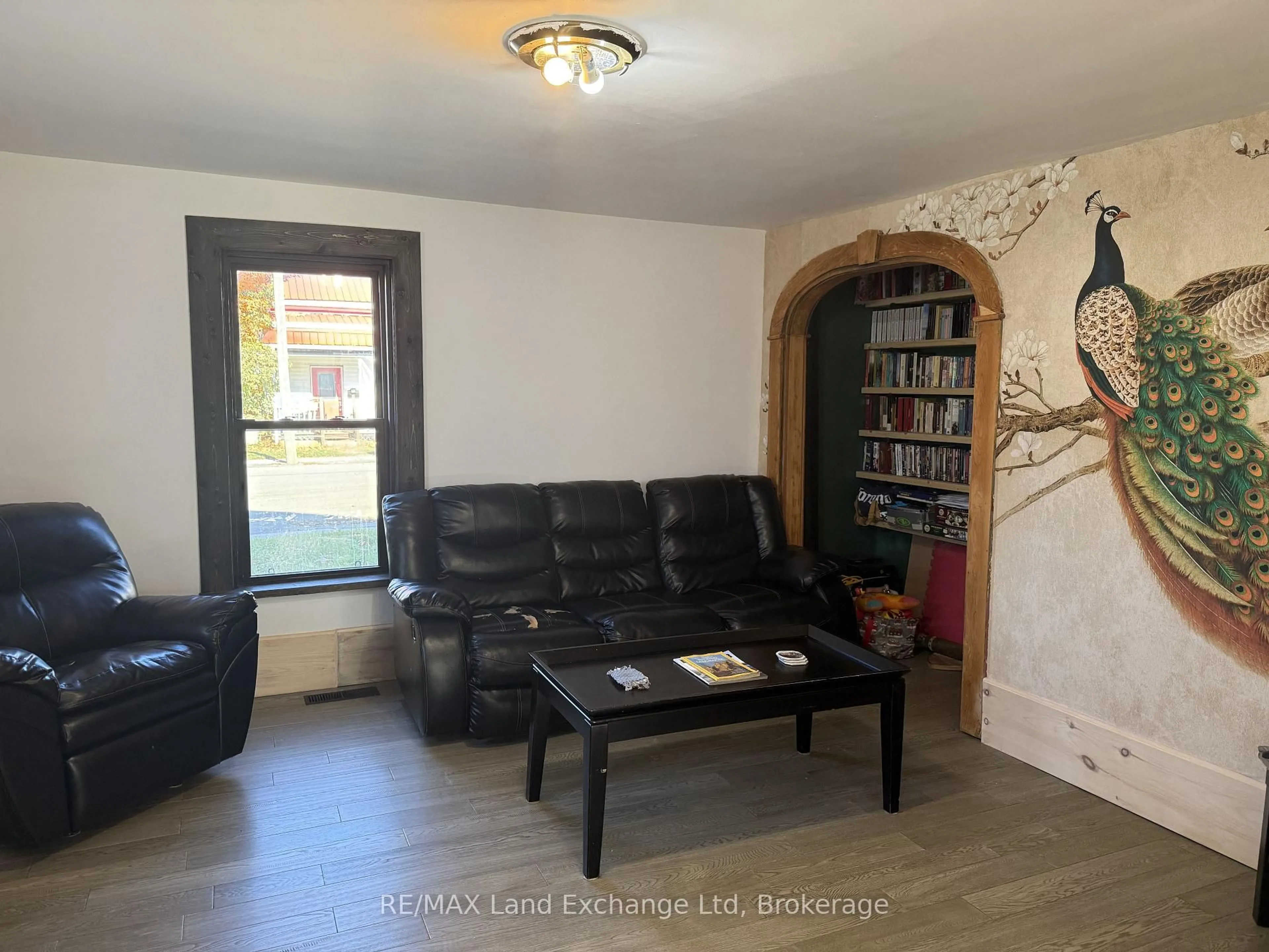Living room with furniture, wood/laminate floor for 26 Patrick St, North Huron Ontario N0G 2W0