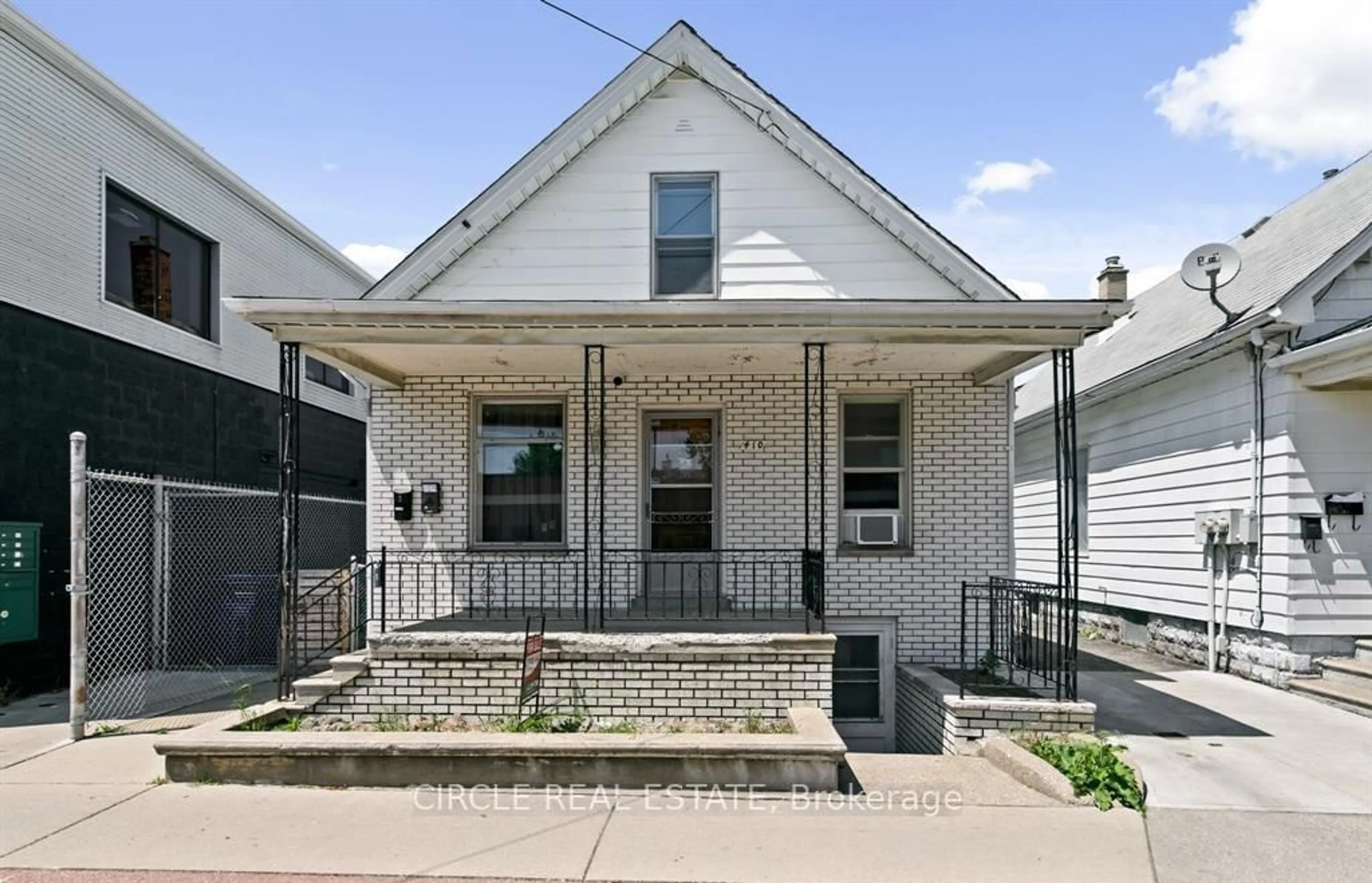 Home with brick exterior material, street for 410 Erie St, Windsor Ontario N9A 3X4