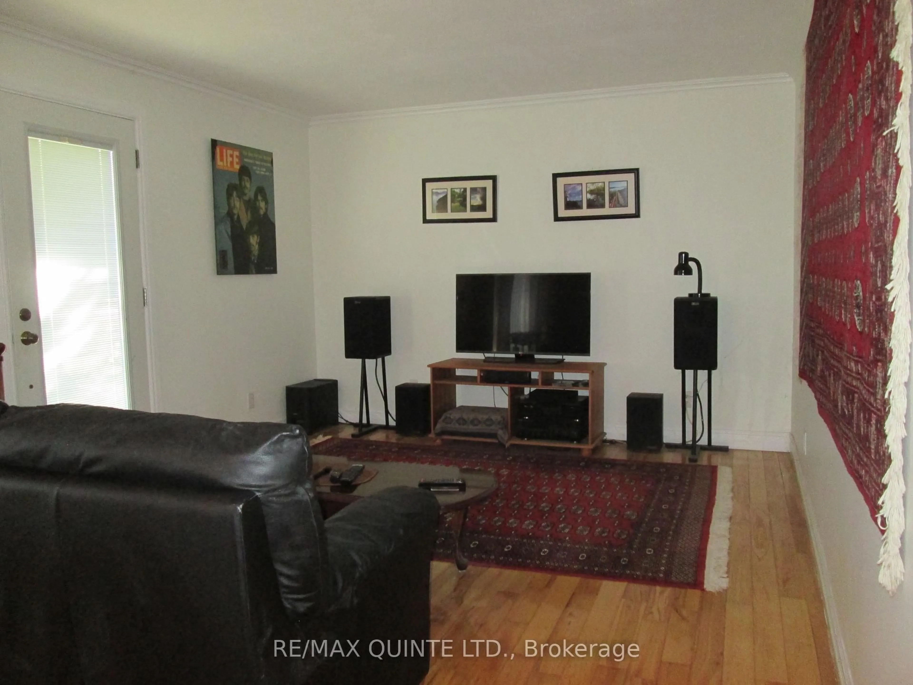 Living room with furniture, wood/laminate floor for 112 Parkview Rd, Prince Edward County Ontario K0K 1L0