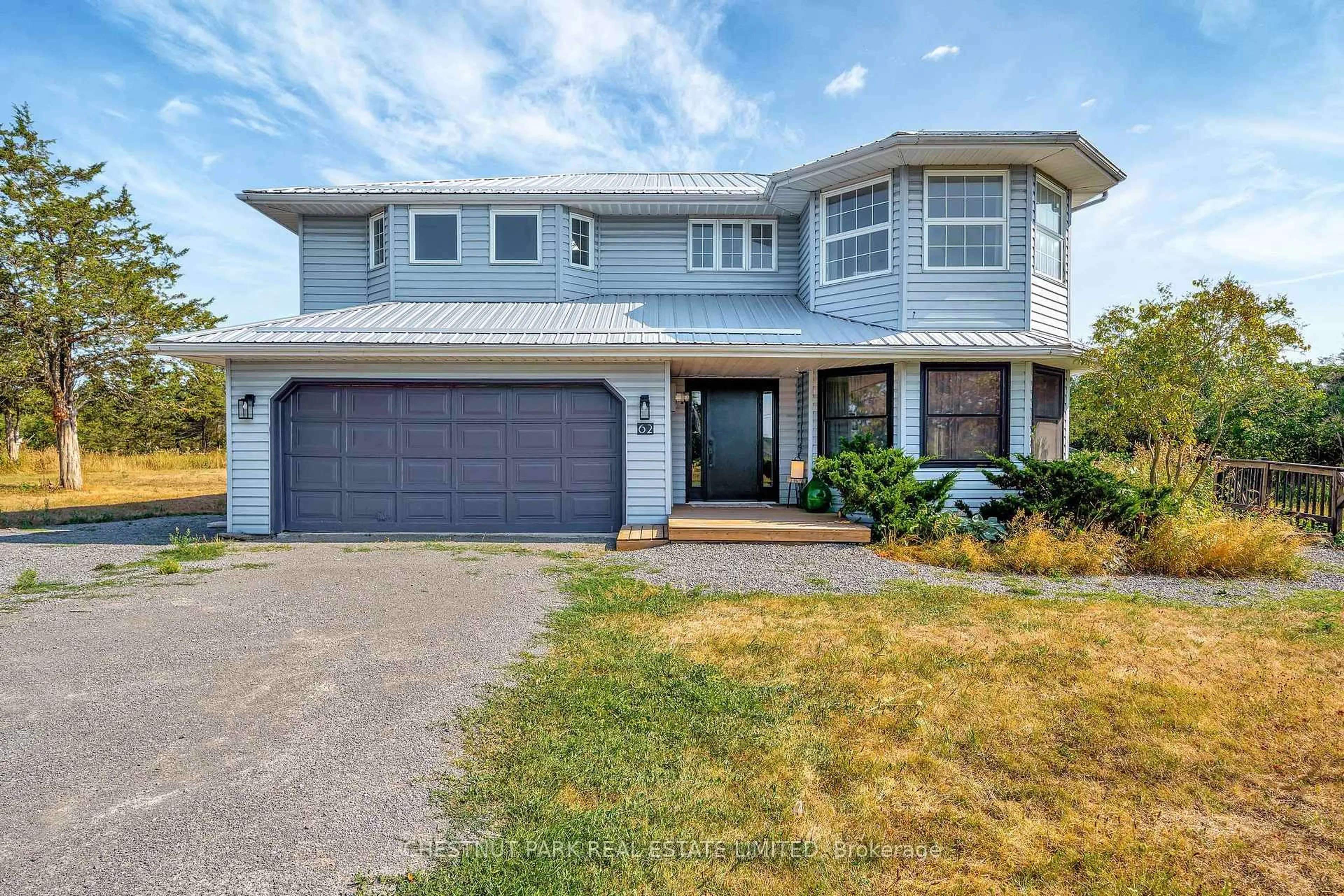 Home with vinyl exterior material, street for 62 Mitchells Crossroad, Prince Edward County Ontario K0K 2T0