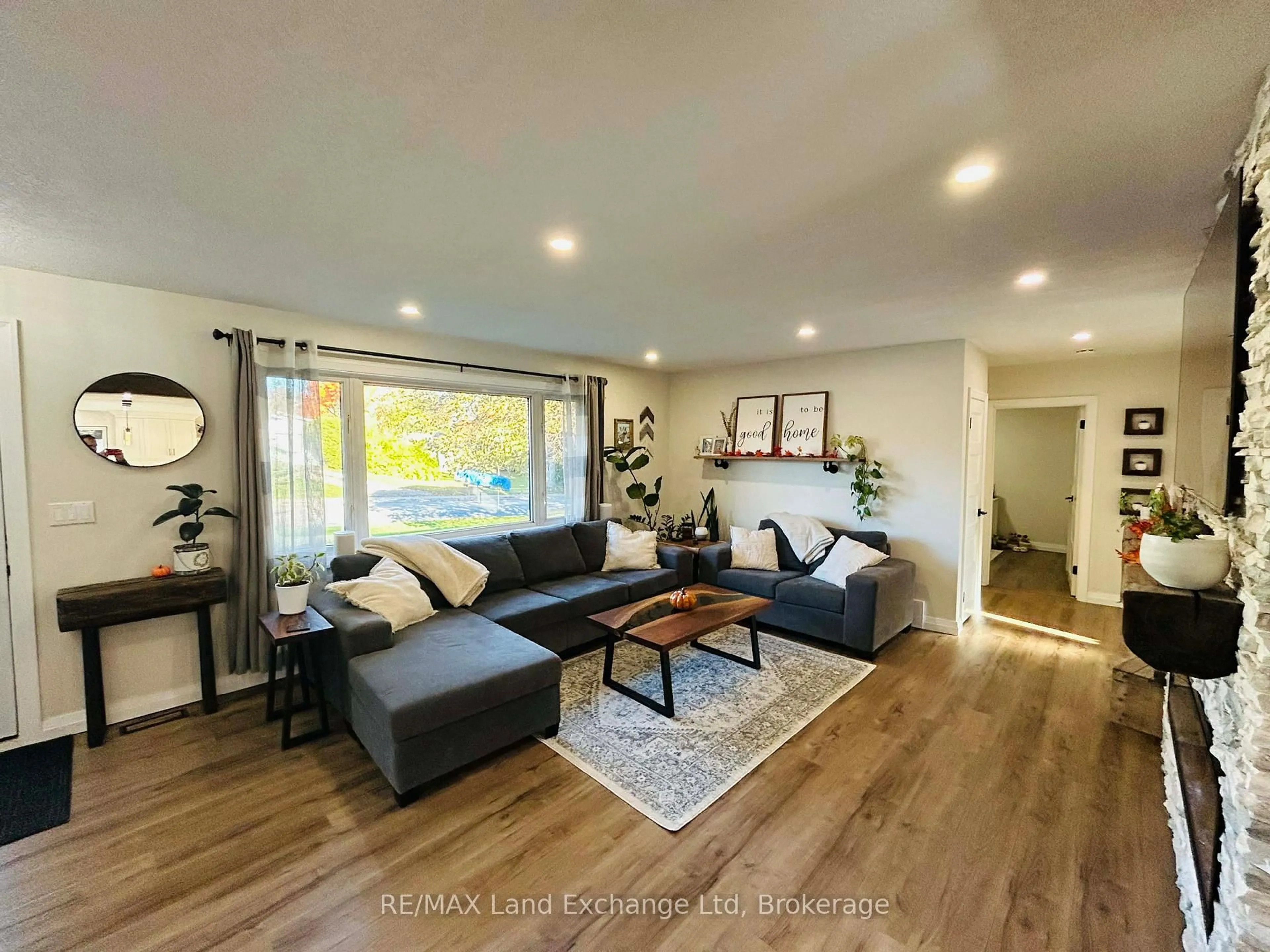 Living room with furniture, wood/laminate floor for 317 Carling Terr, North Huron Ontario N0G 2W0