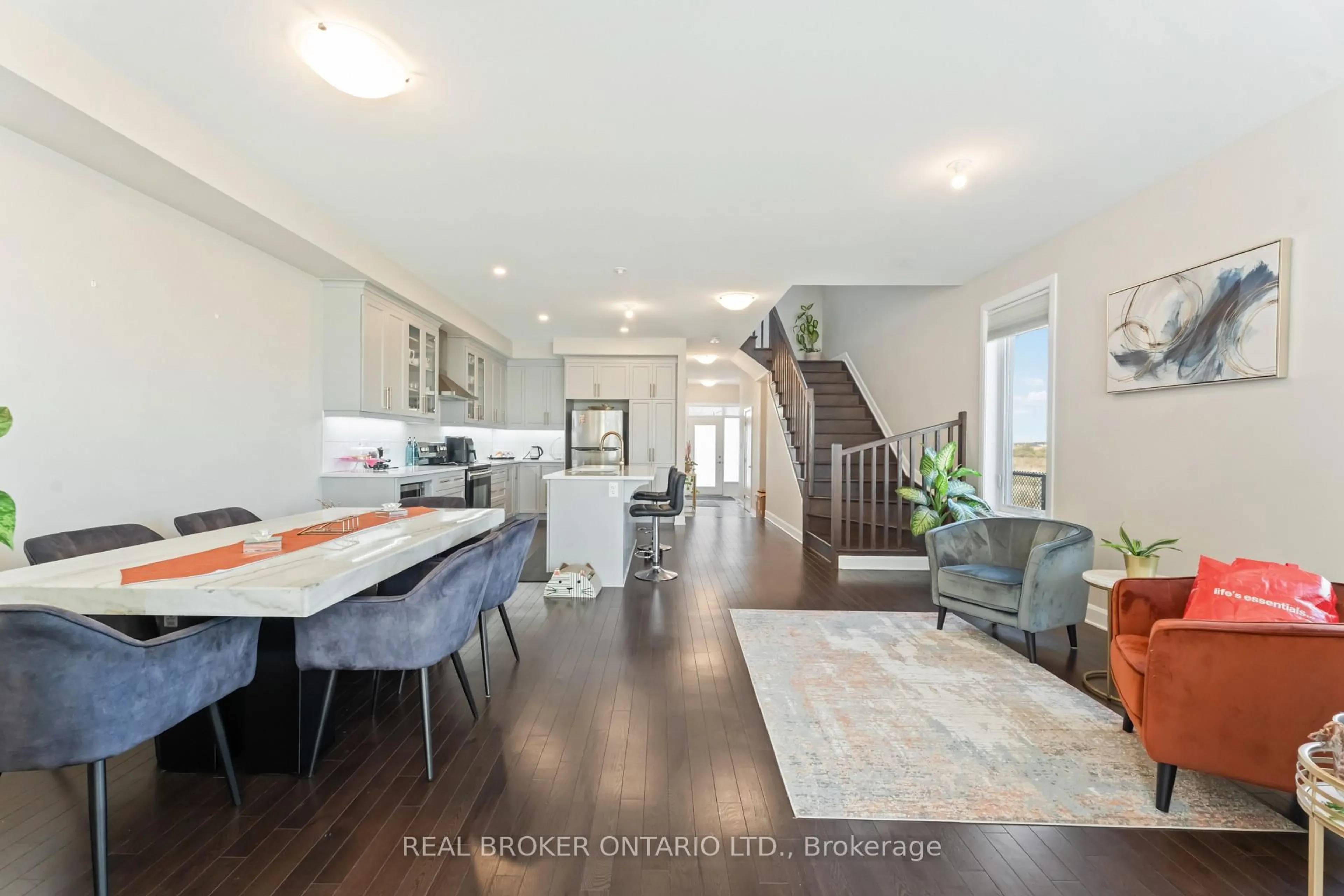 Open concept kitchen, wood/laminate floor for 675 Taliesin Cres, Ottawa Ontario K2S 2W5