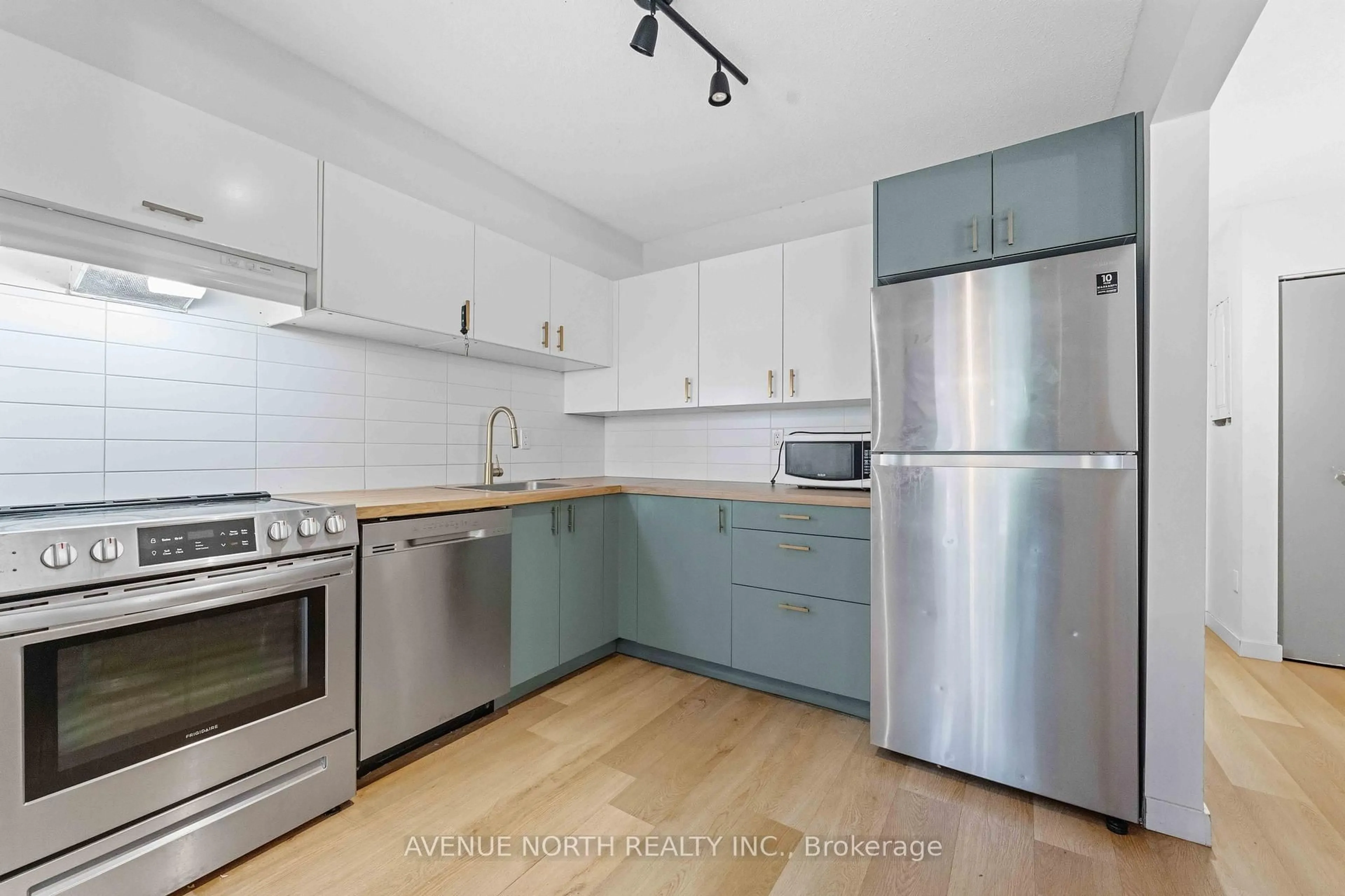 Standard kitchen, wood/laminate floor for 2080 Ogilvie Rd #11K, Ottawa Ontario K1J 7N8