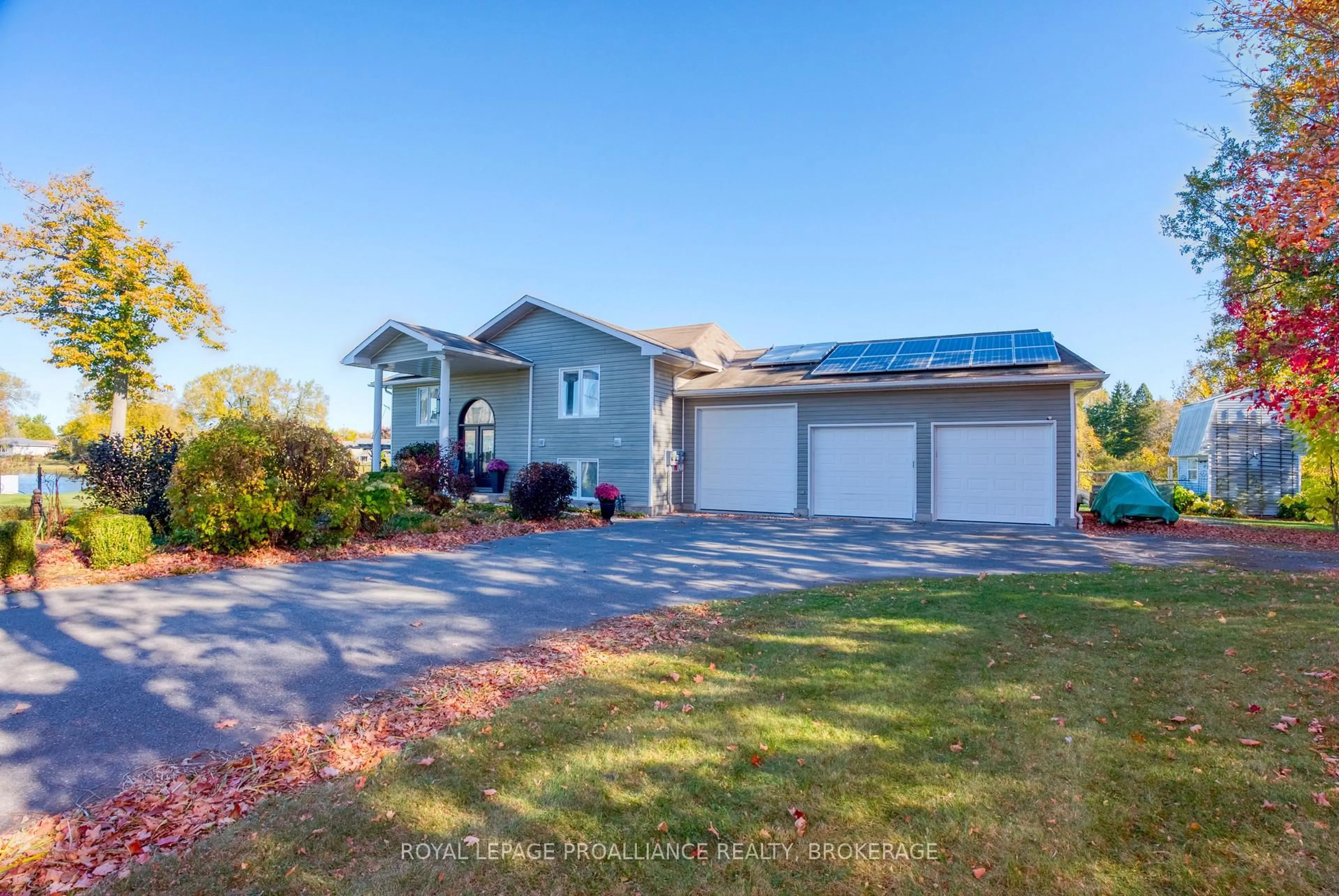 A pic from outside/outdoor area/front of a property/back of a property/a pic from drone, water/lake/river/ocean view for 2318 Highway 15, Kingston Ontario K7L 4V3