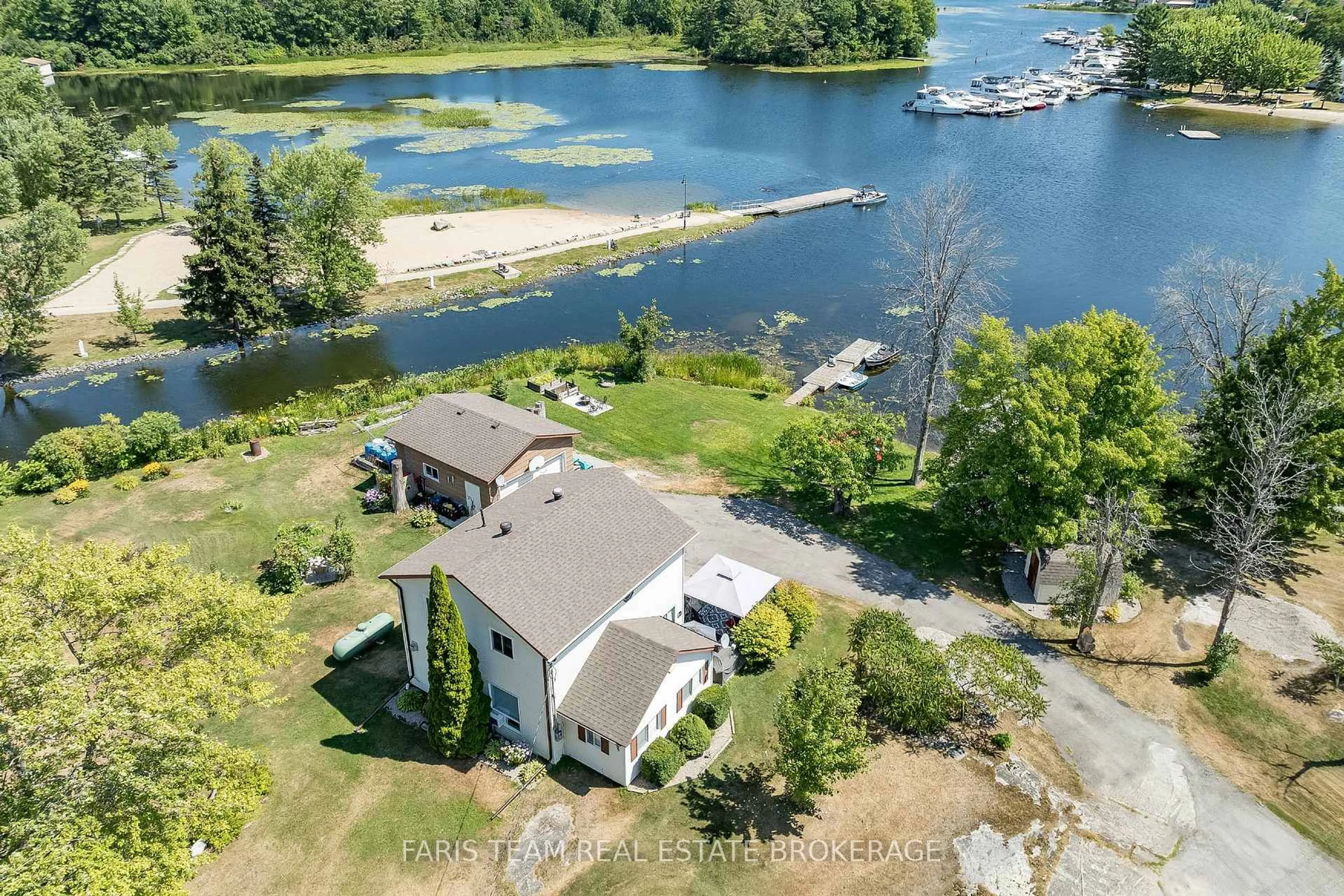 A pic from outside/outdoor area/front of a property/back of a property/a pic from drone, water/lake/river/ocean view for 57 Port Severn Rd, Georgian Bay Ontario L0K 1S0