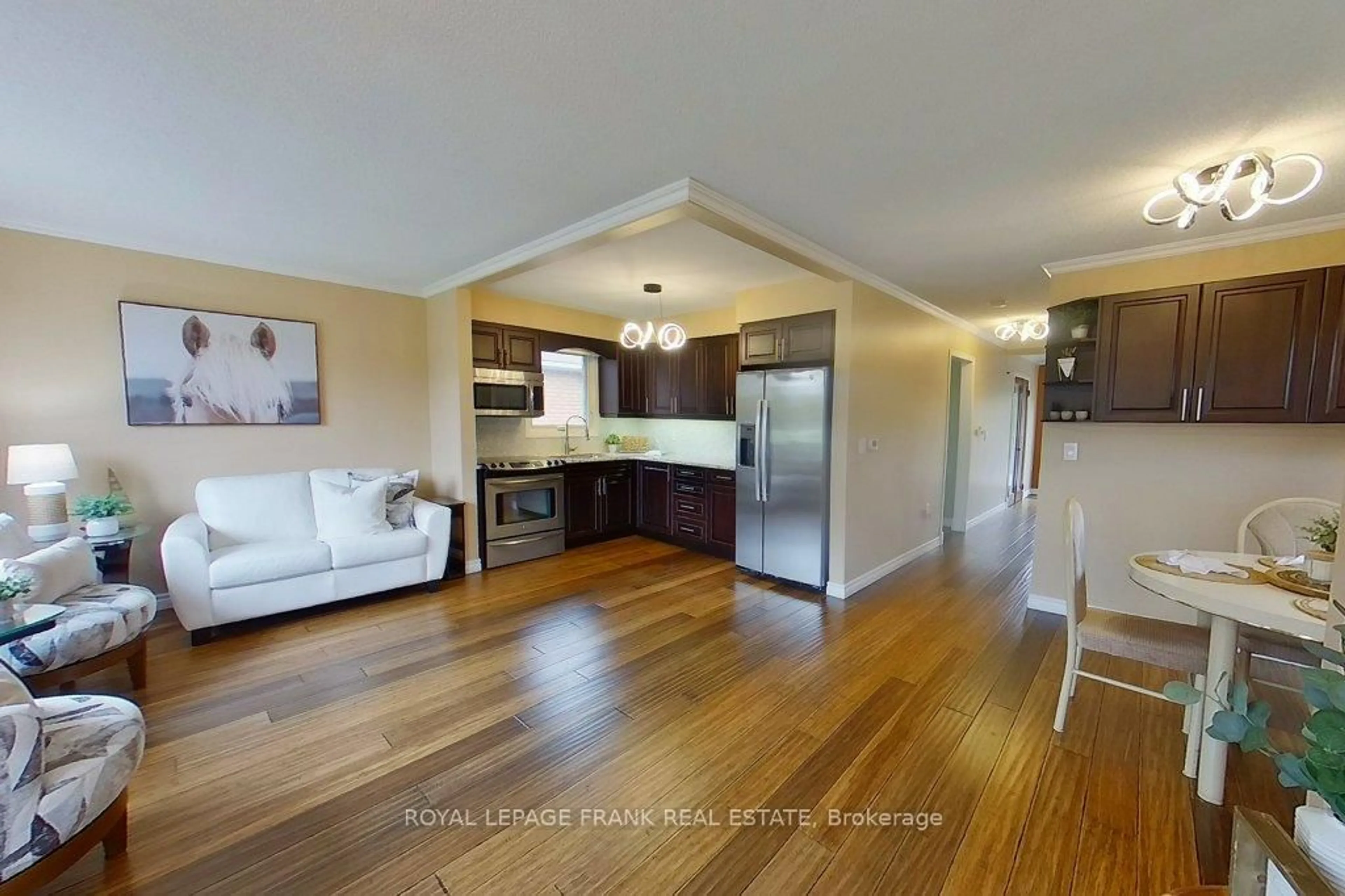 Open concept kitchen, wood/laminate floor for 324 Towerhill Rd, Peterborough Ontario K9H 7R7