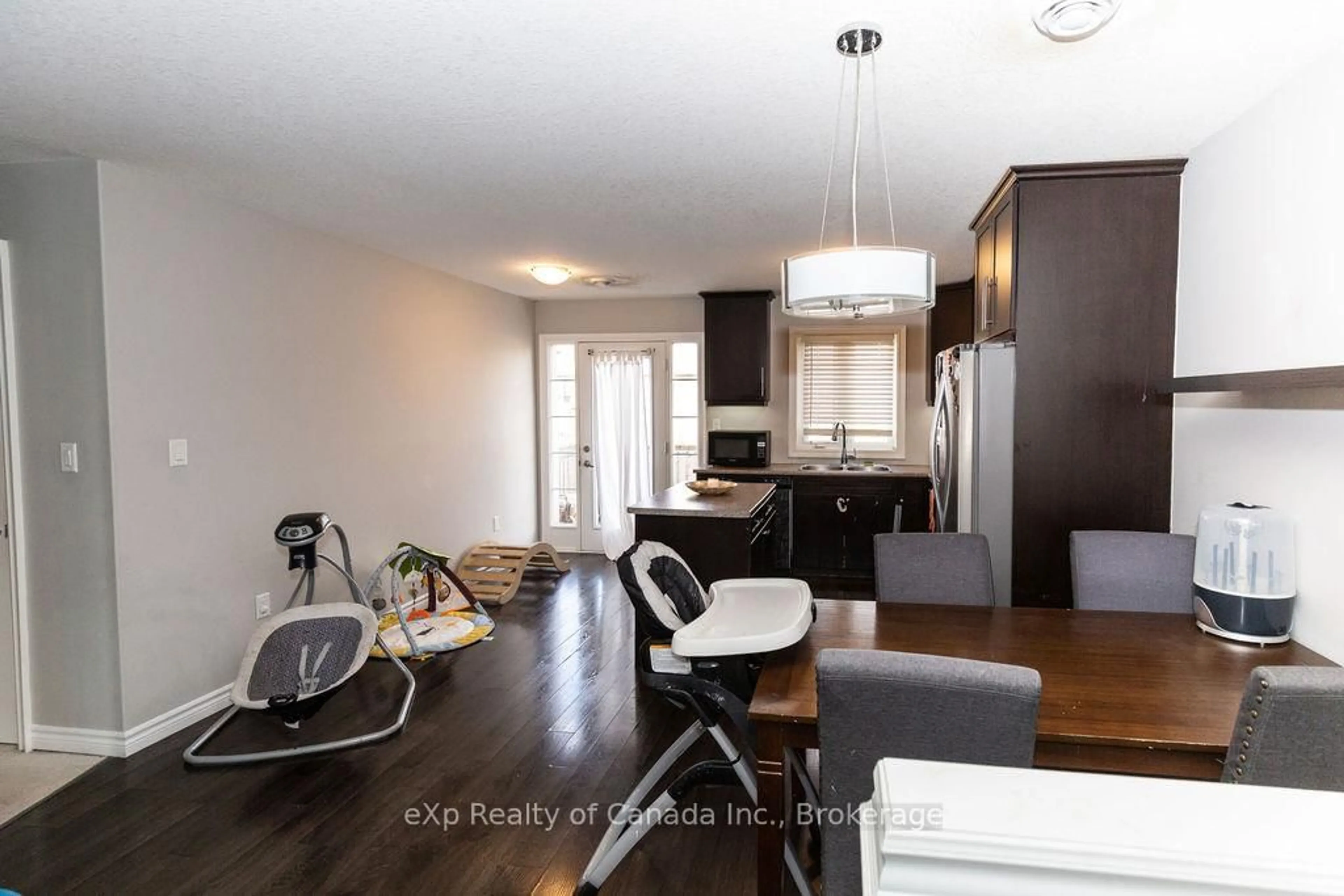 Open concept kitchen, wood/laminate floor for 3320 Meadowgate Blvd #72, London South Ontario N6M 0A7
