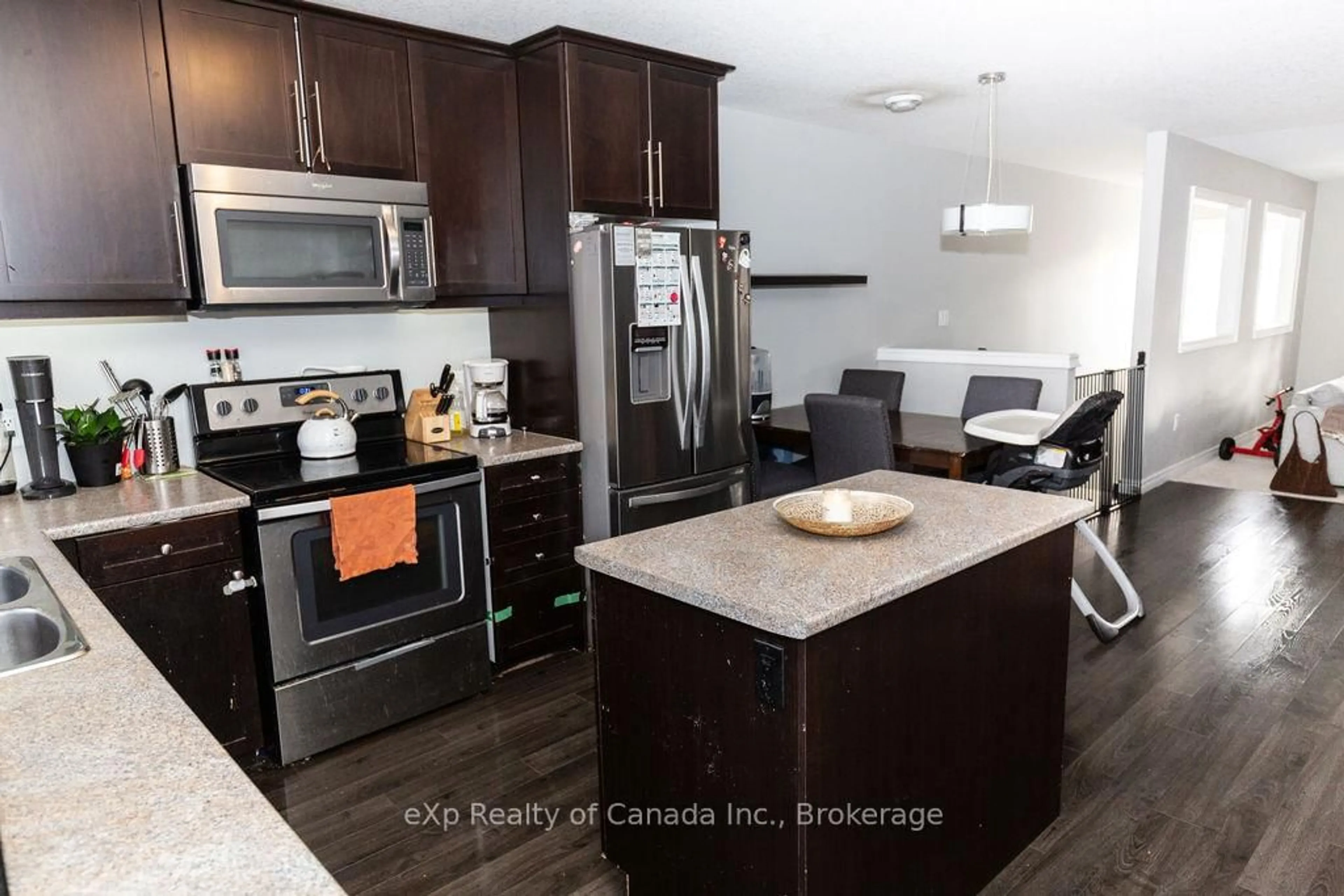 Open concept kitchen, wood/laminate floor for 3320 Meadowgate Blvd #72, London South Ontario N6M 0A7