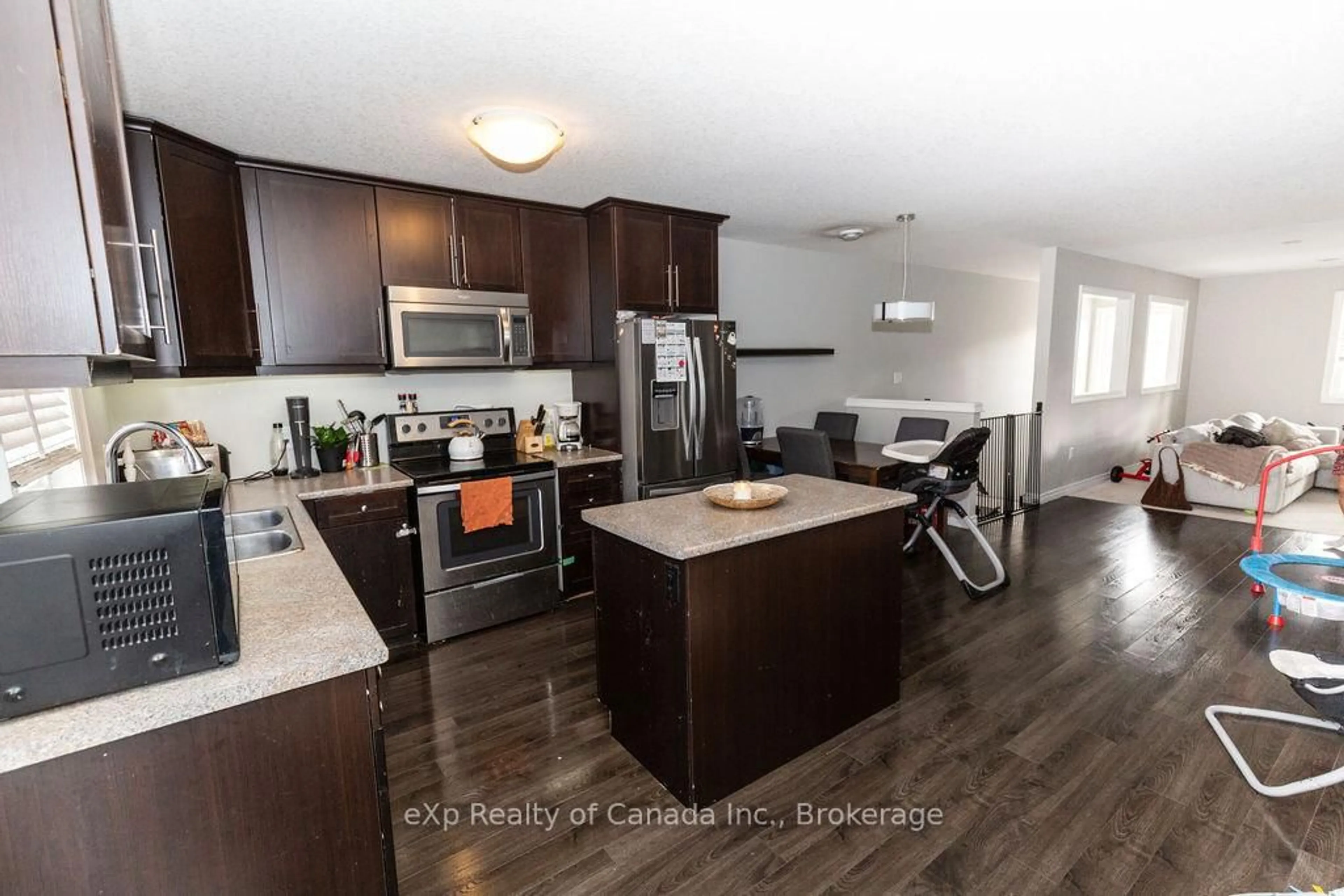 Open concept kitchen, wood/laminate floor for 3320 Meadowgate Blvd #72, London South Ontario N6M 0A7