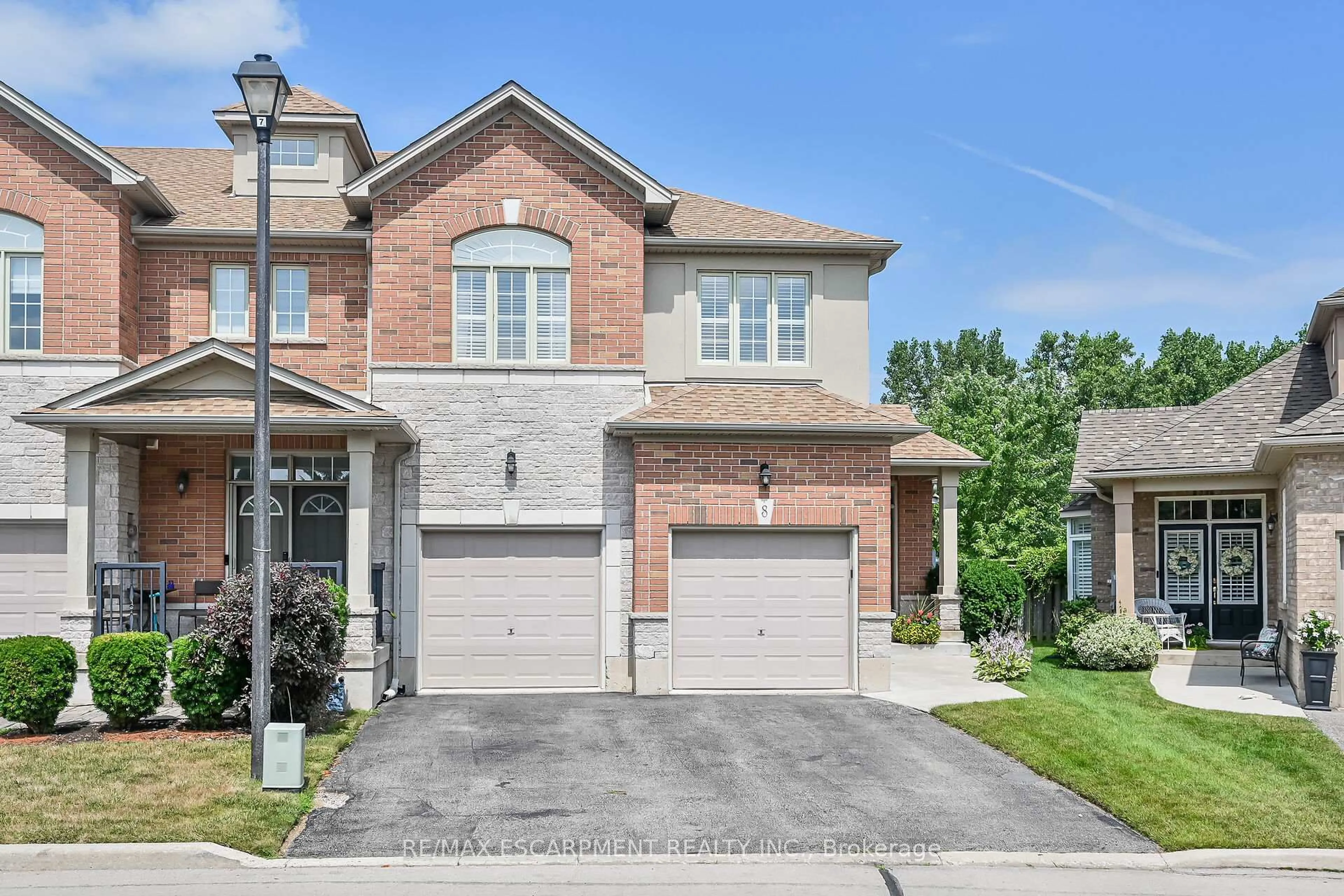 Home with brick exterior material, street for 99 Panabaker Dr #8, Hamilton Ontario L9G 0A3