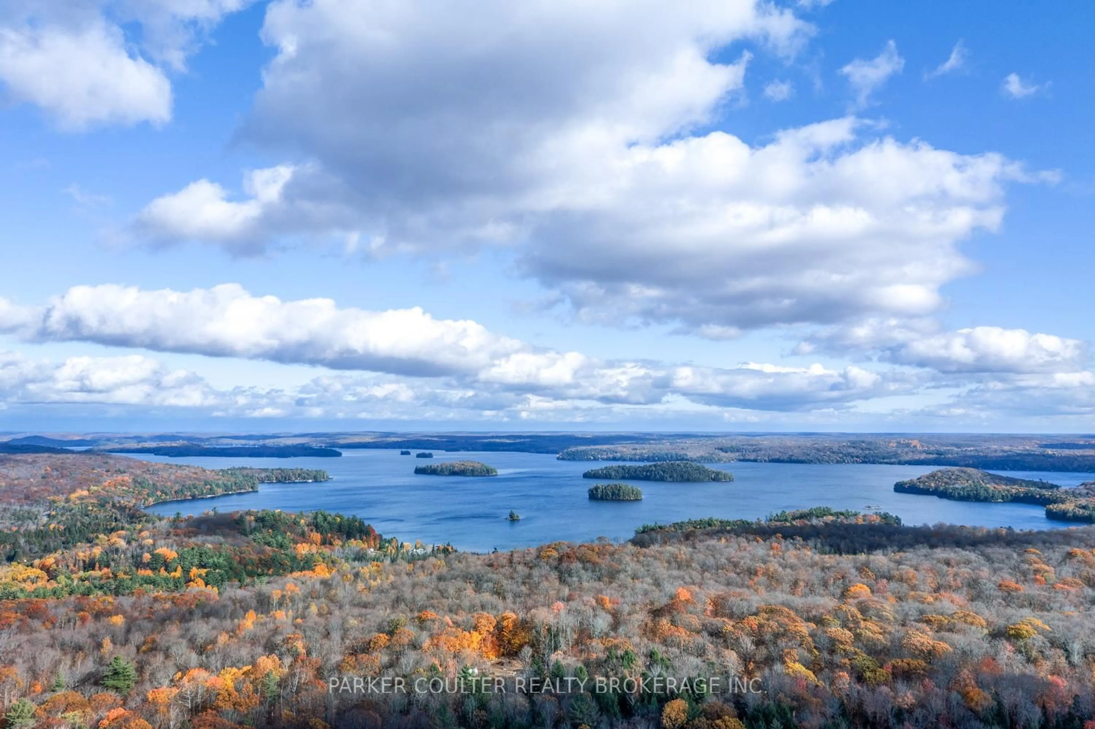 A pic from outside/outdoor area/front of a property/back of a property/a pic from drone, water/lake/river/ocean view for 561 White House Rd, Huntsville Ontario P1H 2J3