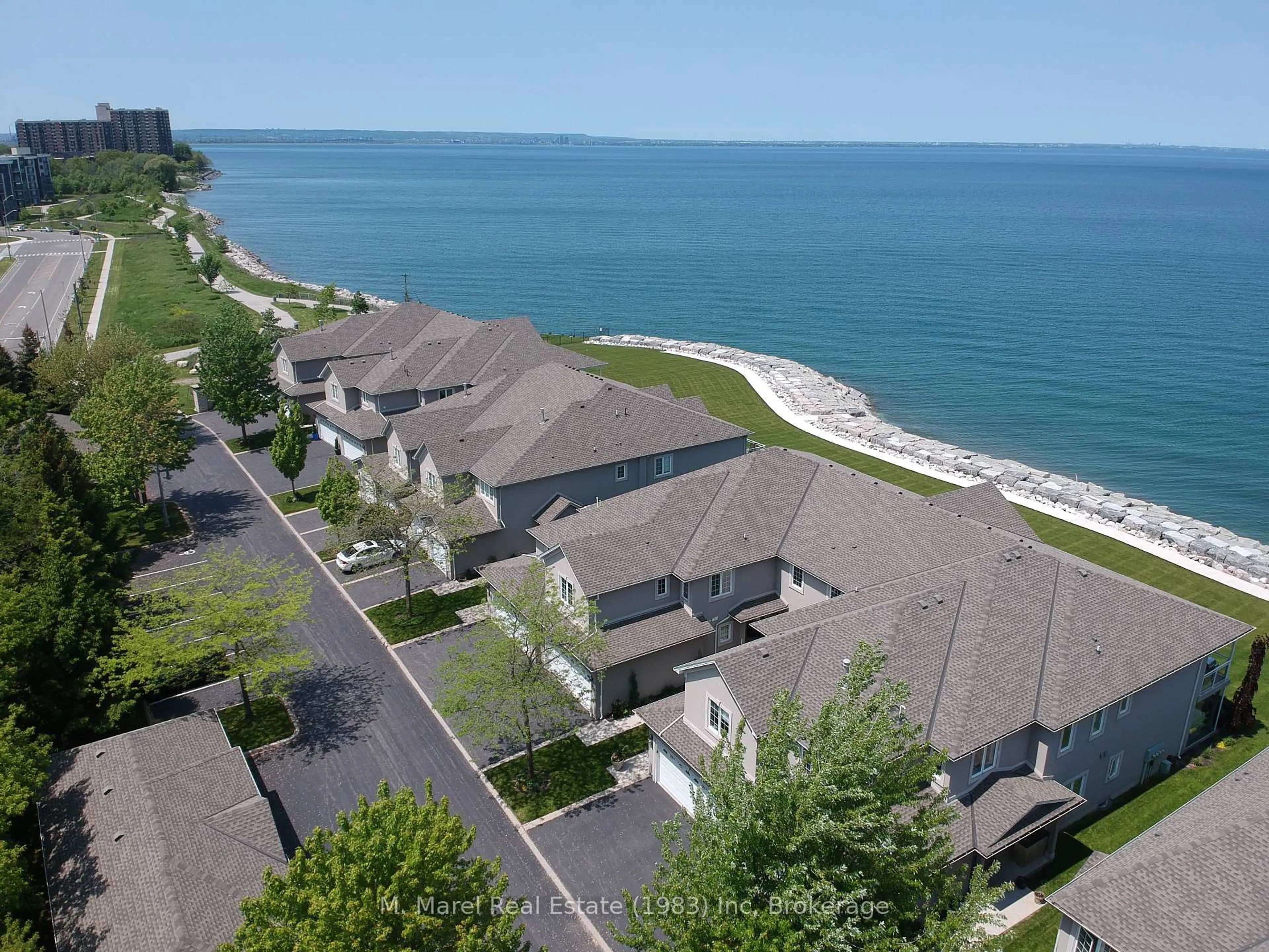 A pic from outside/outdoor area/front of a property/back of a property/a pic from drone, water/lake/river/ocean view for 484 Millen Rd #9, Hamilton Ontario L8E 6G4