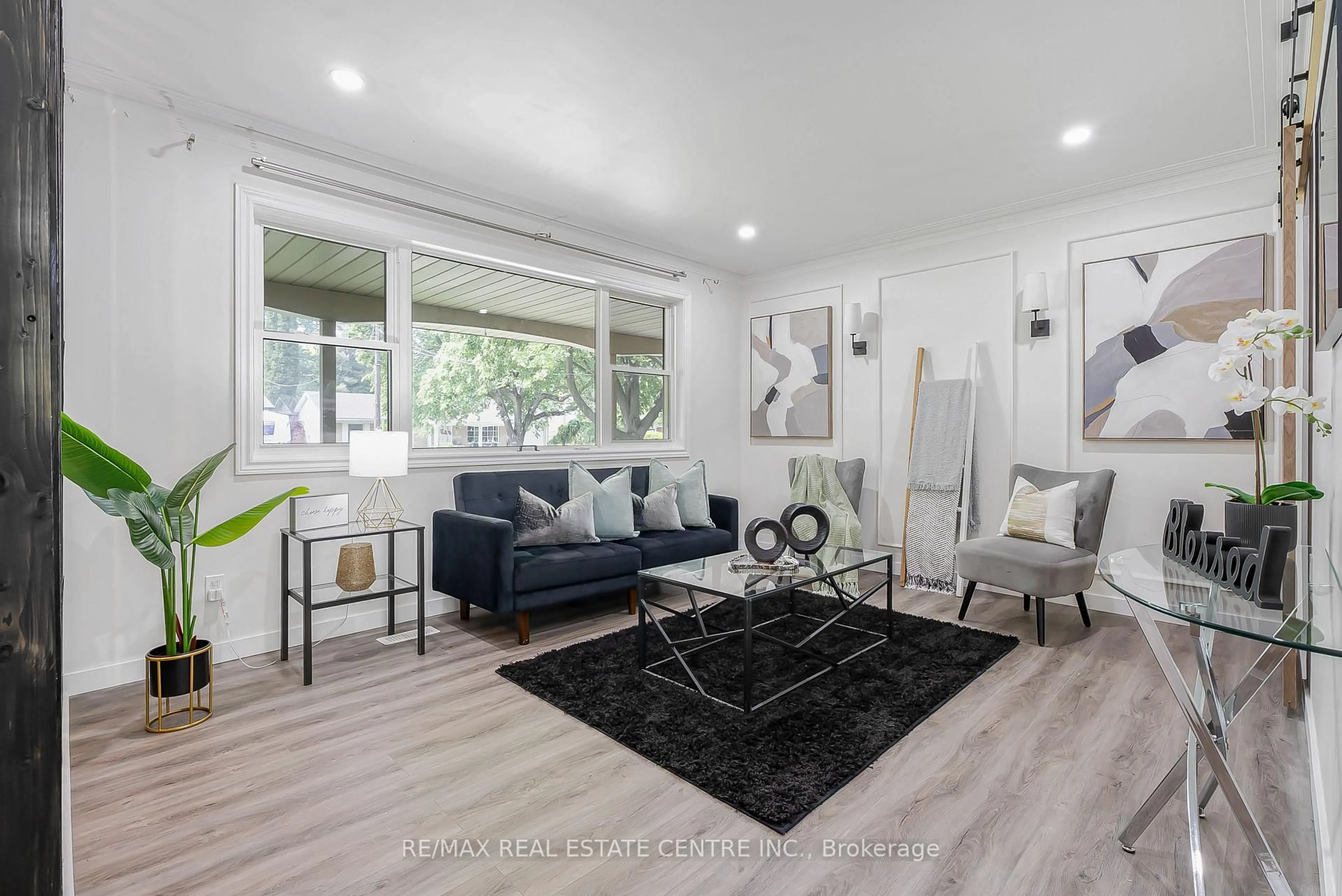 Living room with furniture, wood/laminate floor for 95 Ripplewood Cres, Kitchener Ontario N2M 4R9