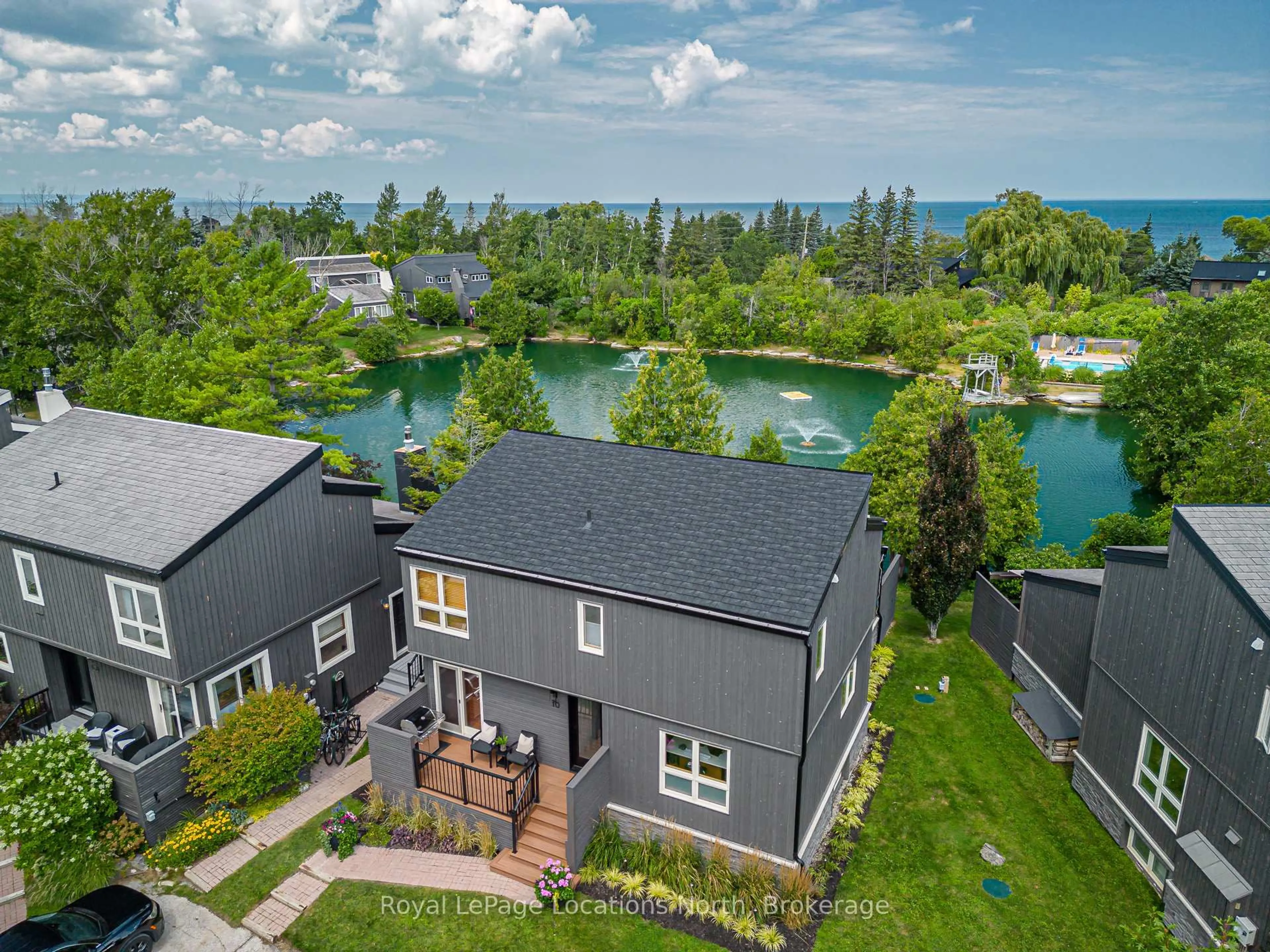 A pic from outside/outdoor area/front of a property/back of a property/a pic from drone, water/lake/river/ocean view for 116 Hidden Lake Rd #10, Blue Mountains Ontario L9Y 0T6