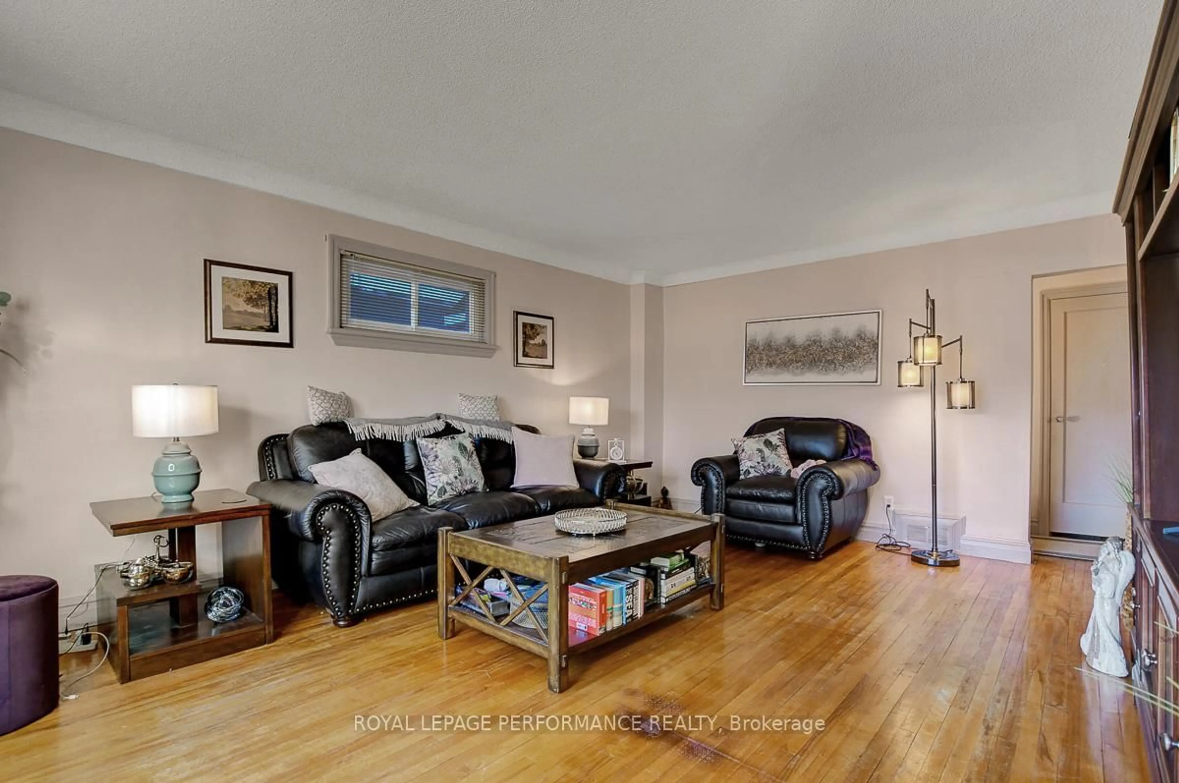 Living room with furniture, wood/laminate floor for 103 Glynn Ave, Ottawa Ontario K1K 1S7