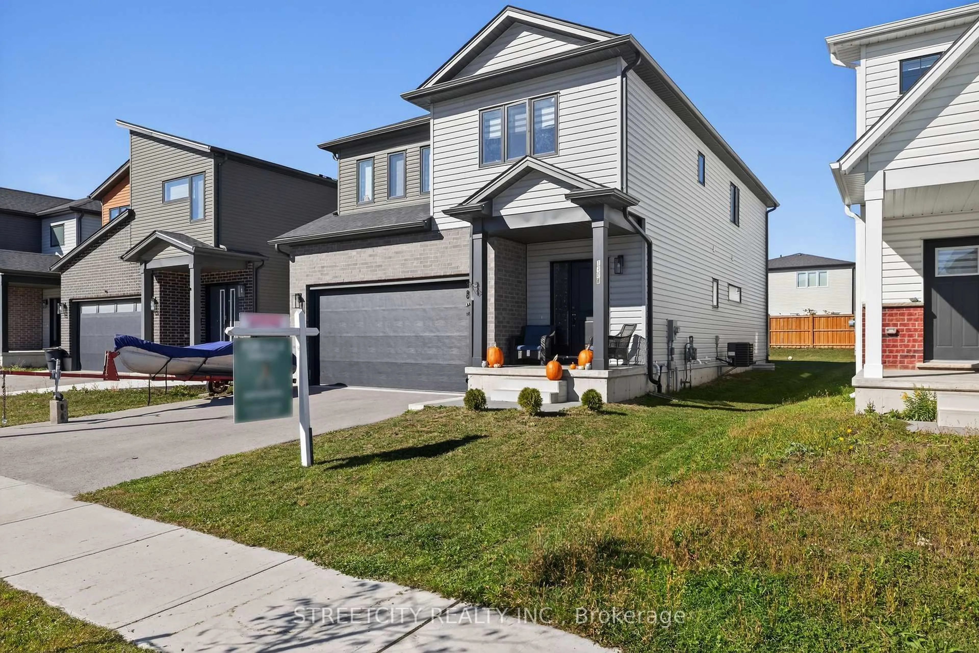 Home with vinyl exterior material, street for 1408 Twilite Blvd, London North Ontario N6G 3R5