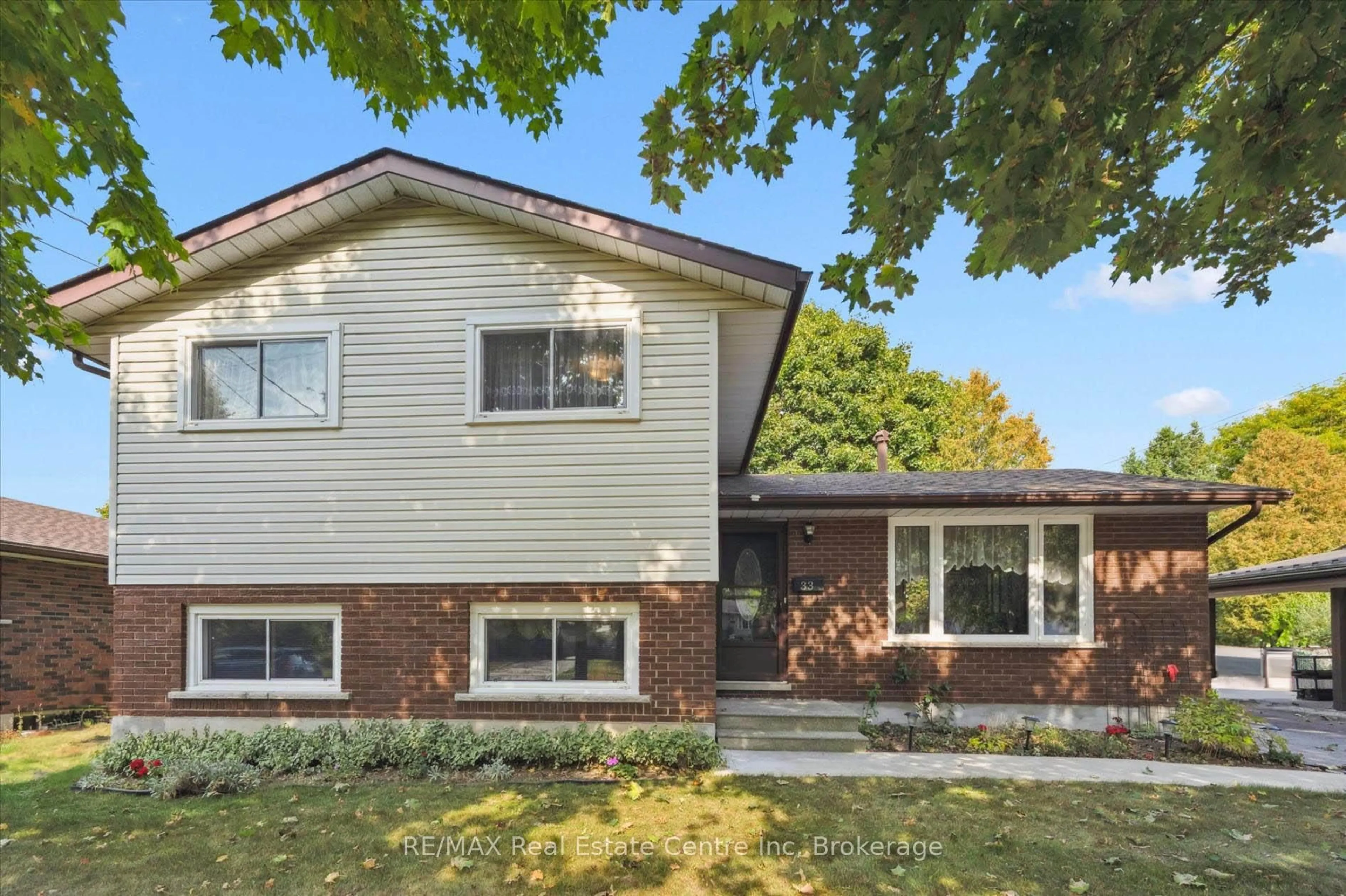 Home with brick exterior material, street for 33 Hastings Blvd, Guelph Ontario N1E 4G3