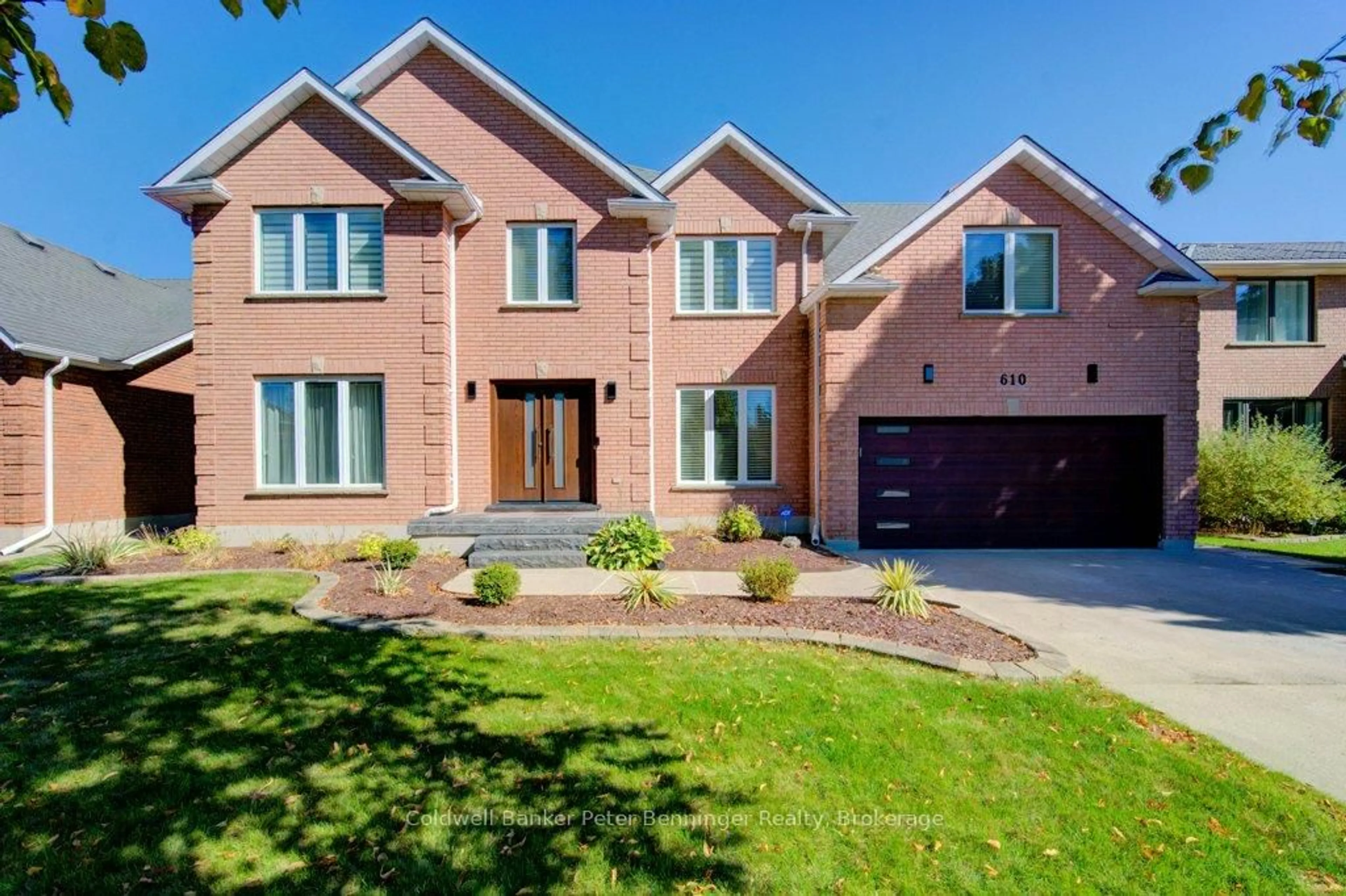Home with brick exterior material, street for 610 Stonebury Cres, Waterloo Ontario N2K 3R1