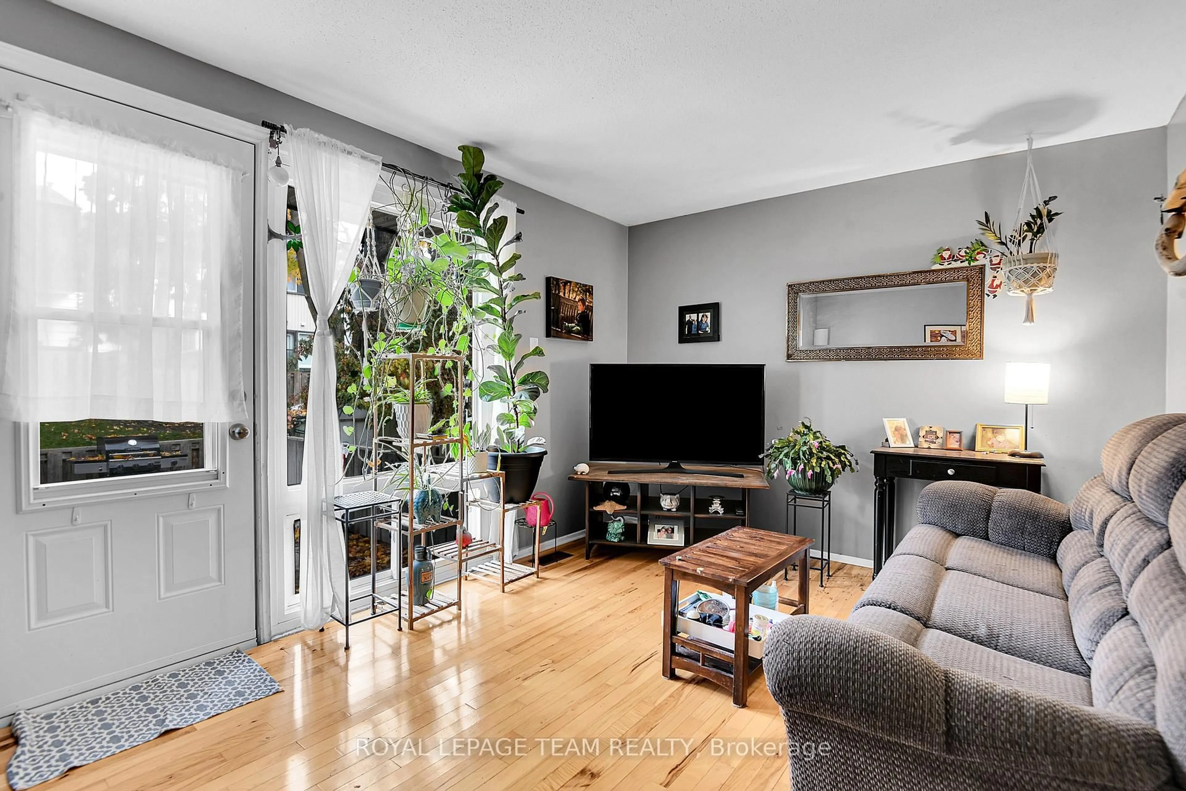 Living room with furniture, unknown for 902 Elmsmere Rd #B, Ottawa Ontario K1J 7T6