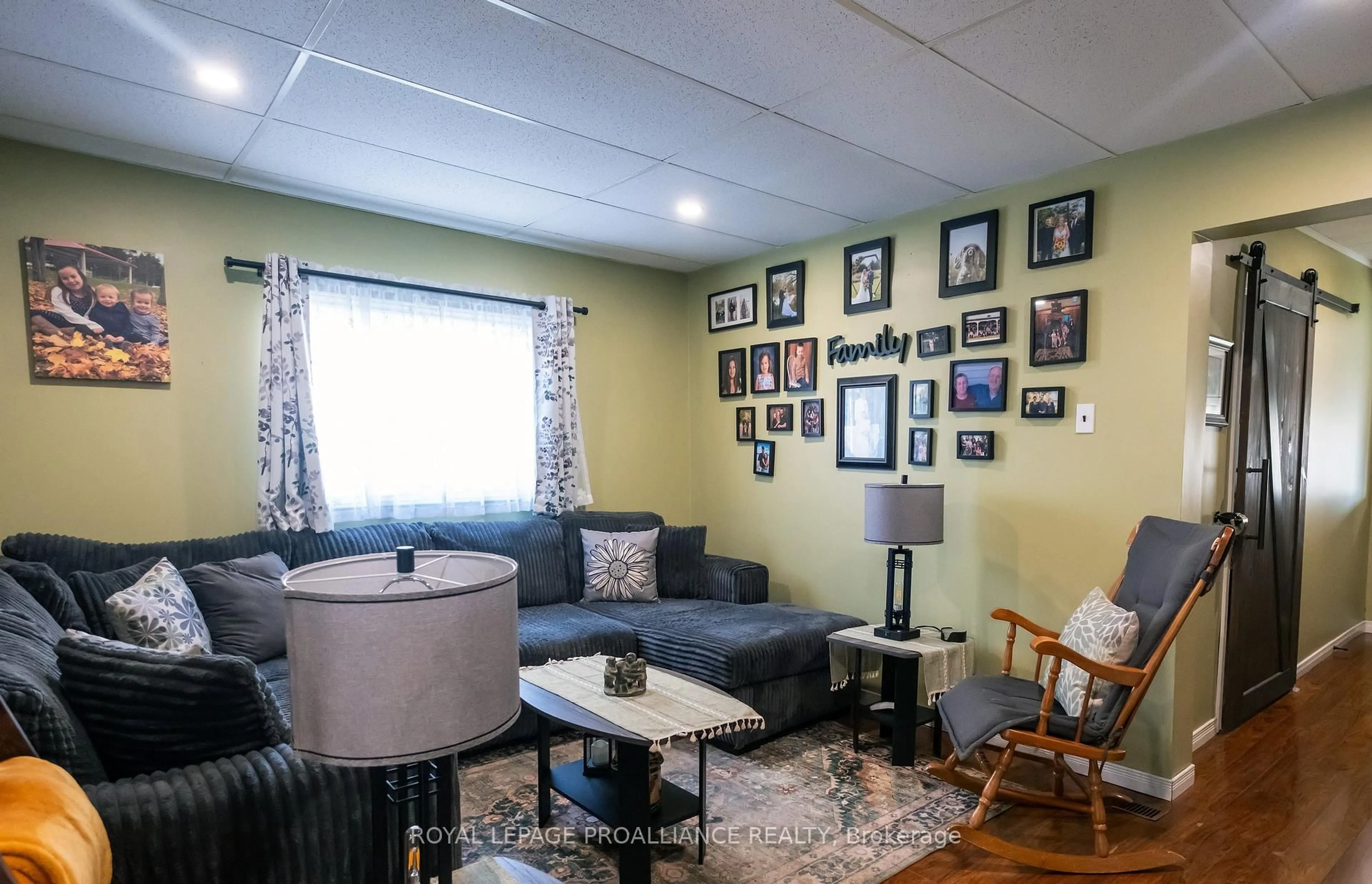 Living room with furniture, wood/laminate floor for 42 Prince Of Wales Dr, Belleville Ontario K8P 2T7