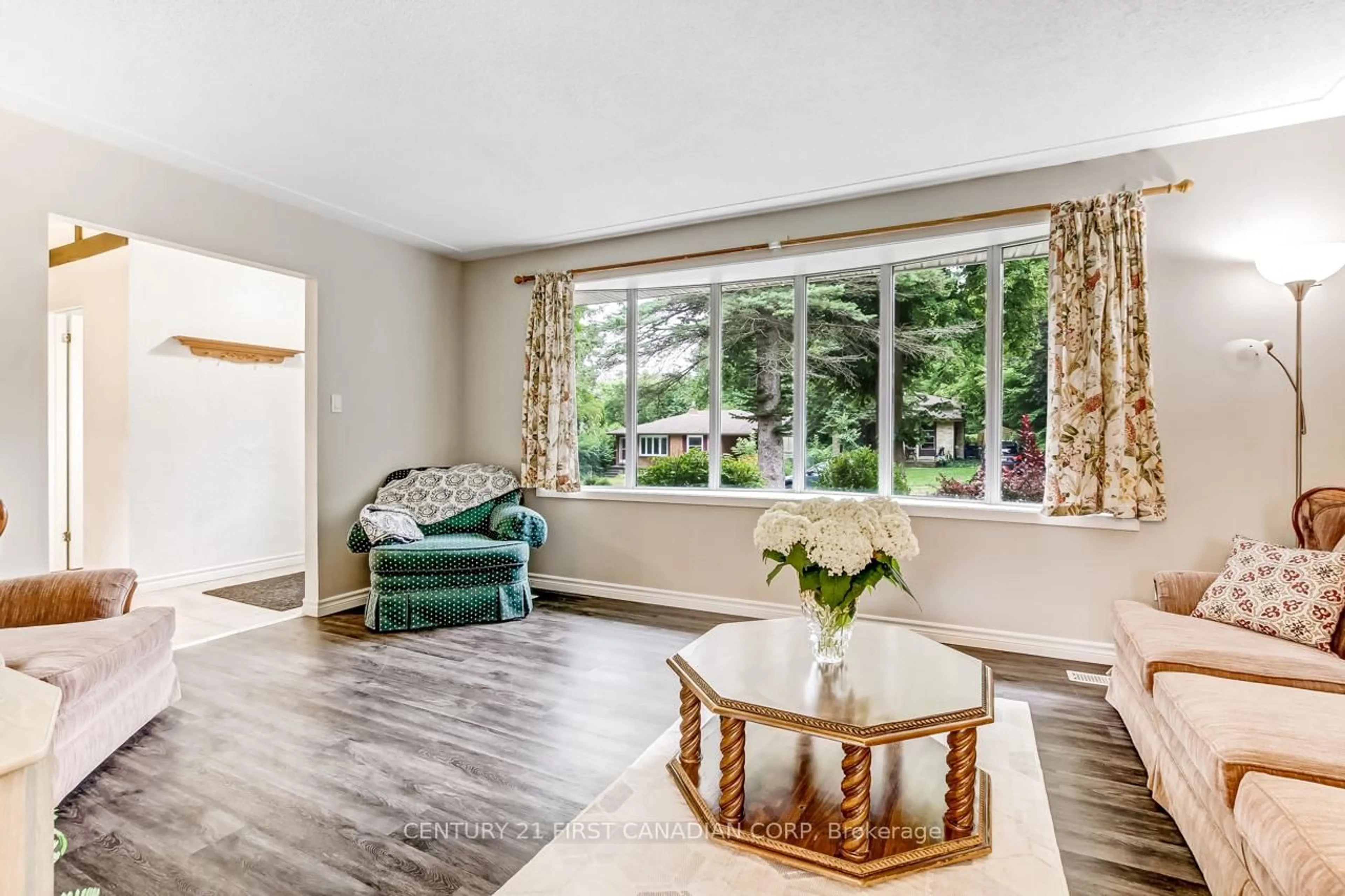 Living room with furniture, wood/laminate floor for 440 Castlegrove Blvd, London North Ontario N6G 1K8