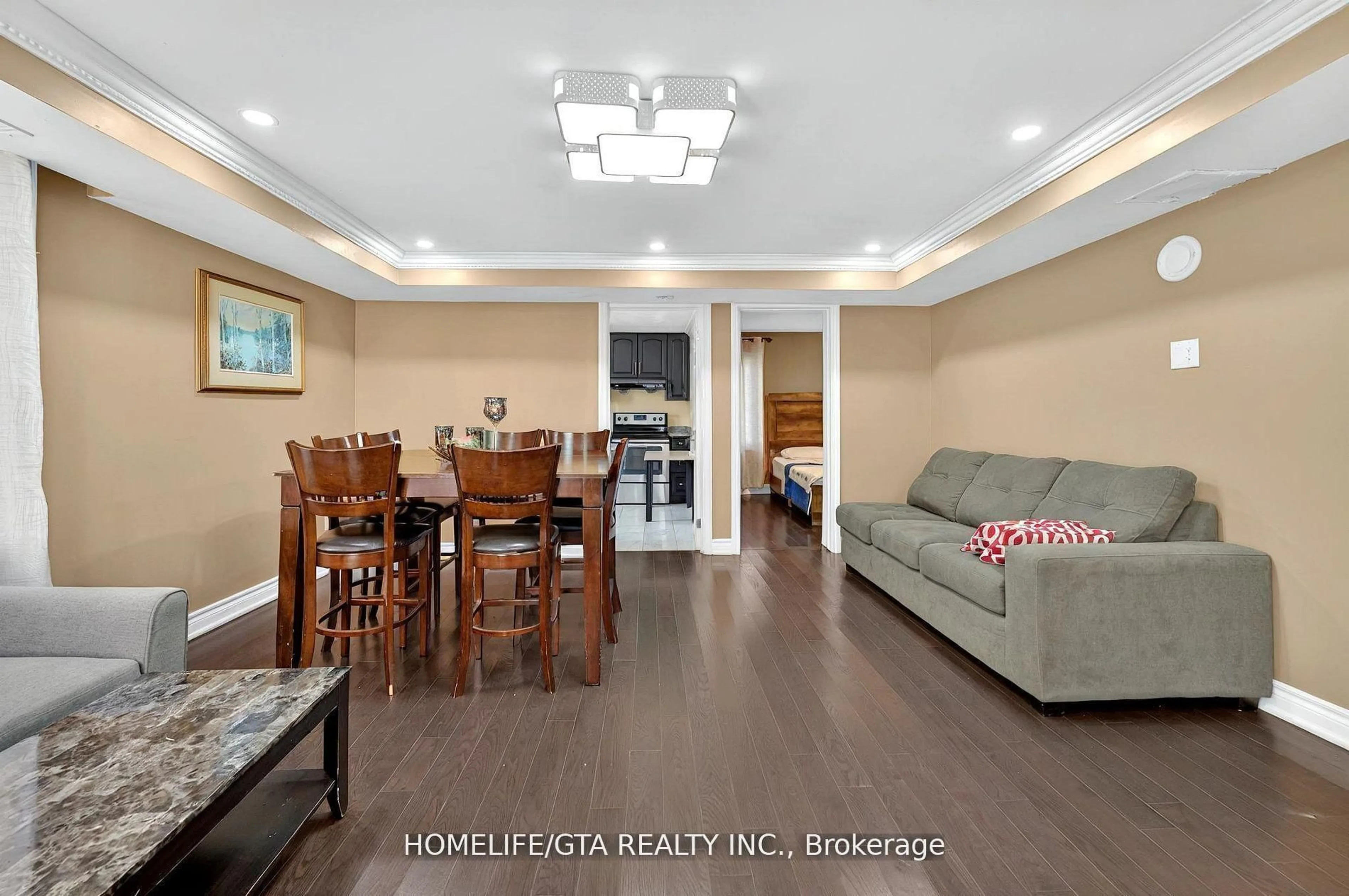 Living room with furniture, wood/laminate floor for 9334 County Road 2, Hamilton Township Ontario K9A 4J8