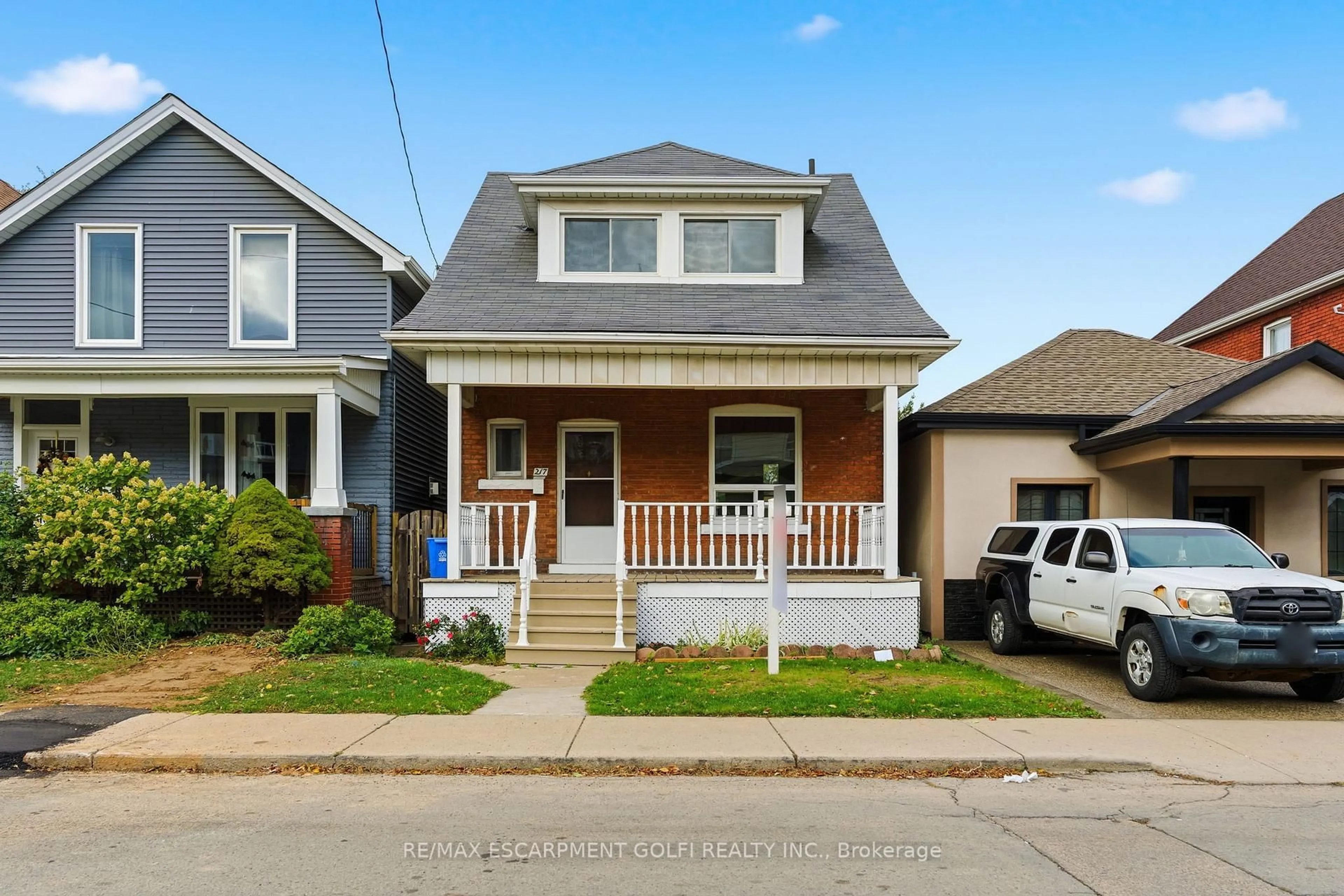 Home with vinyl exterior material, street for 217 Emerald St, Hamilton Ontario L8L 5L1