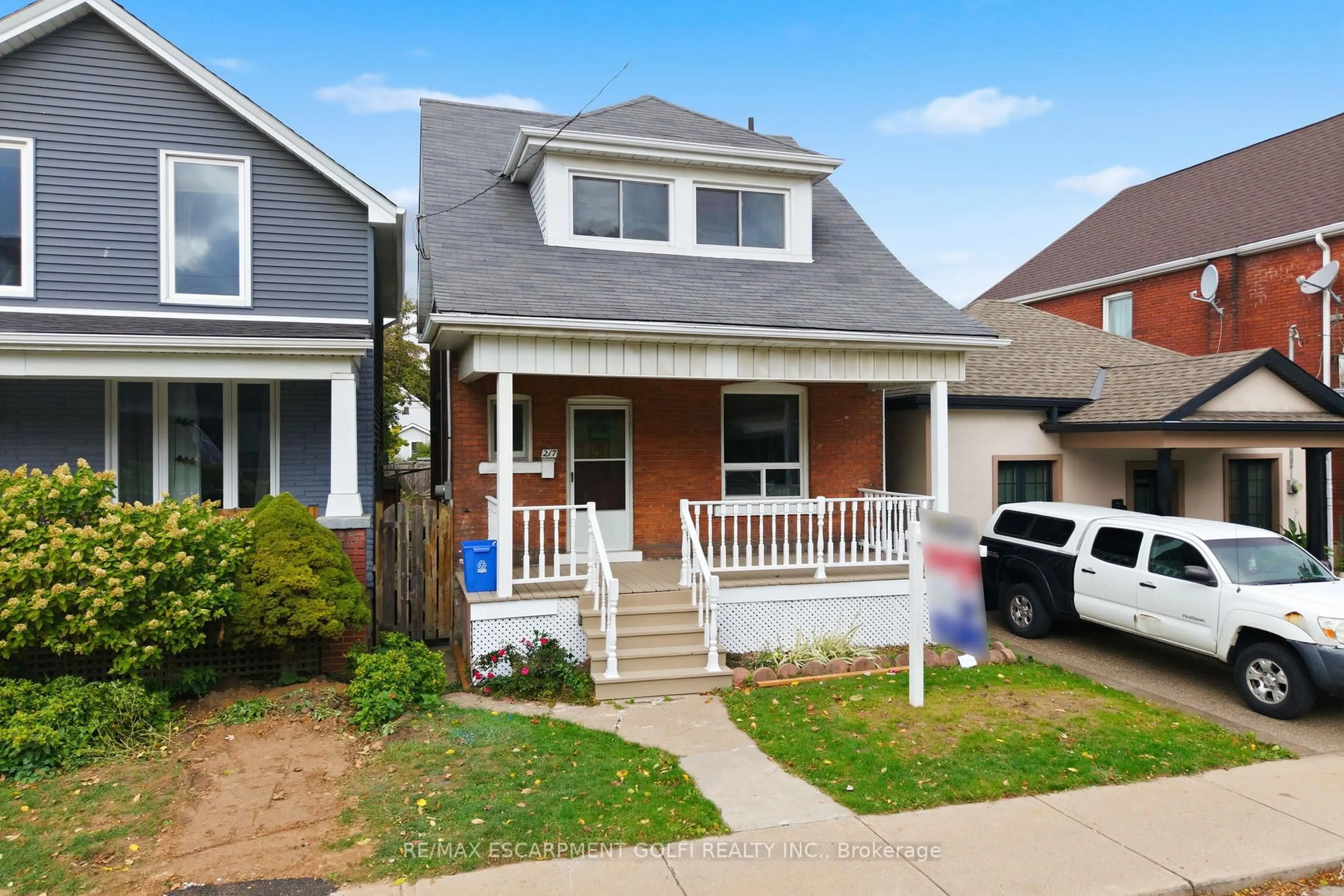 Home with vinyl exterior material, street for 217 Emerald St, Hamilton Ontario L8L 5L1