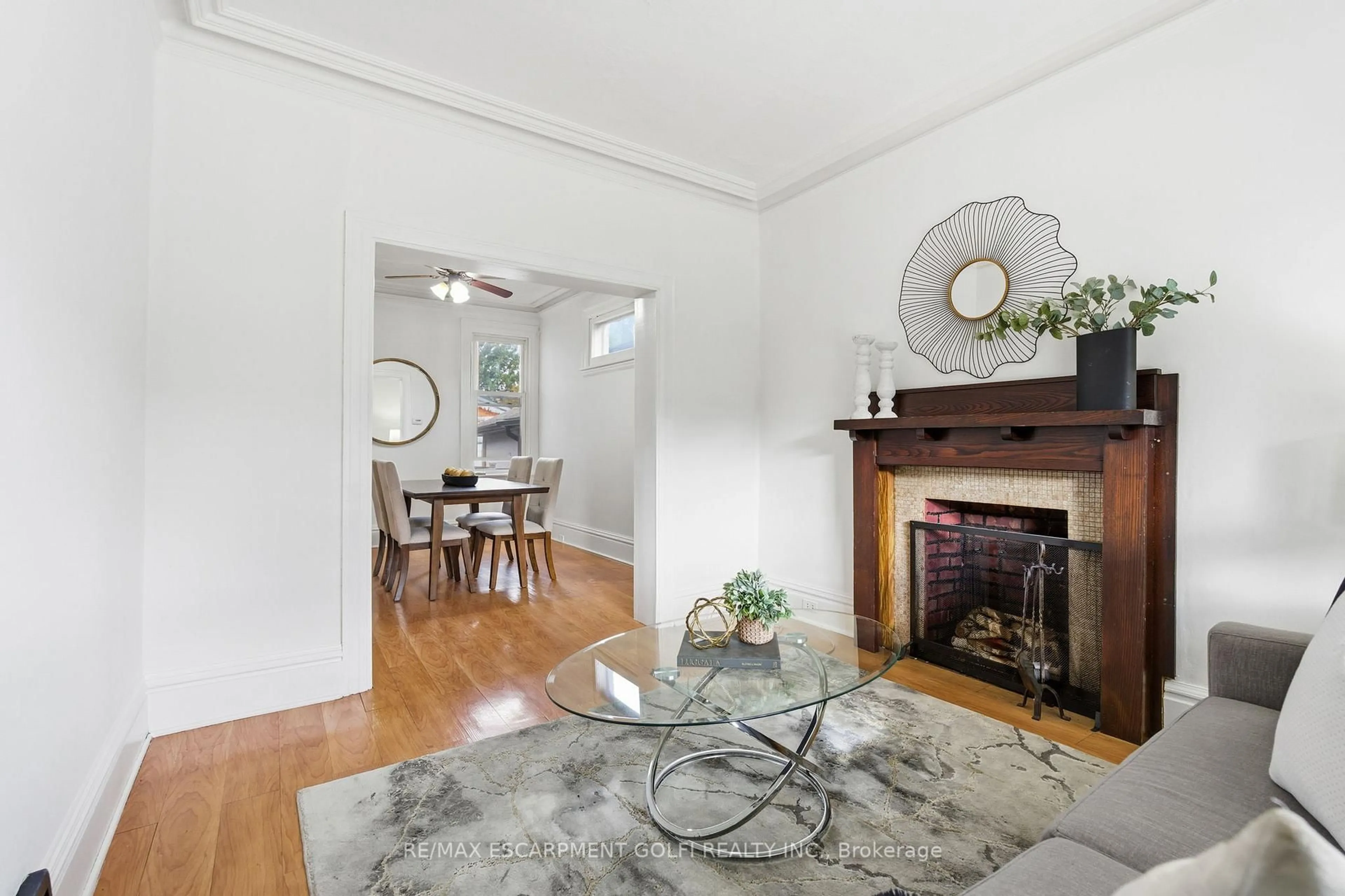 Living room with furniture, wood/laminate floor for 217 Emerald St, Hamilton Ontario L8L 5L1