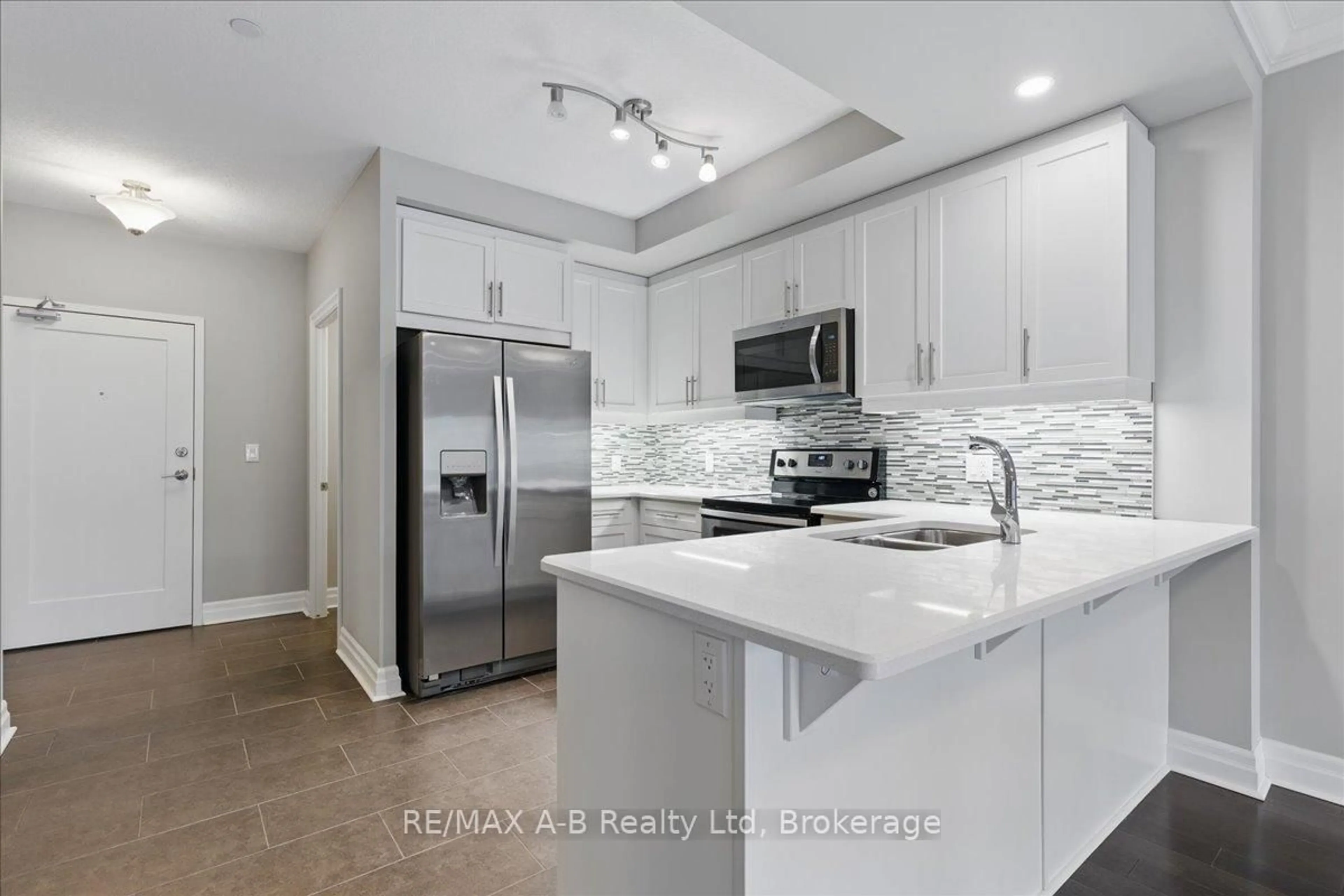 Open concept kitchen, ceramic/tile floor for 255 John St #206, Stratford Ontario N5A 0G7