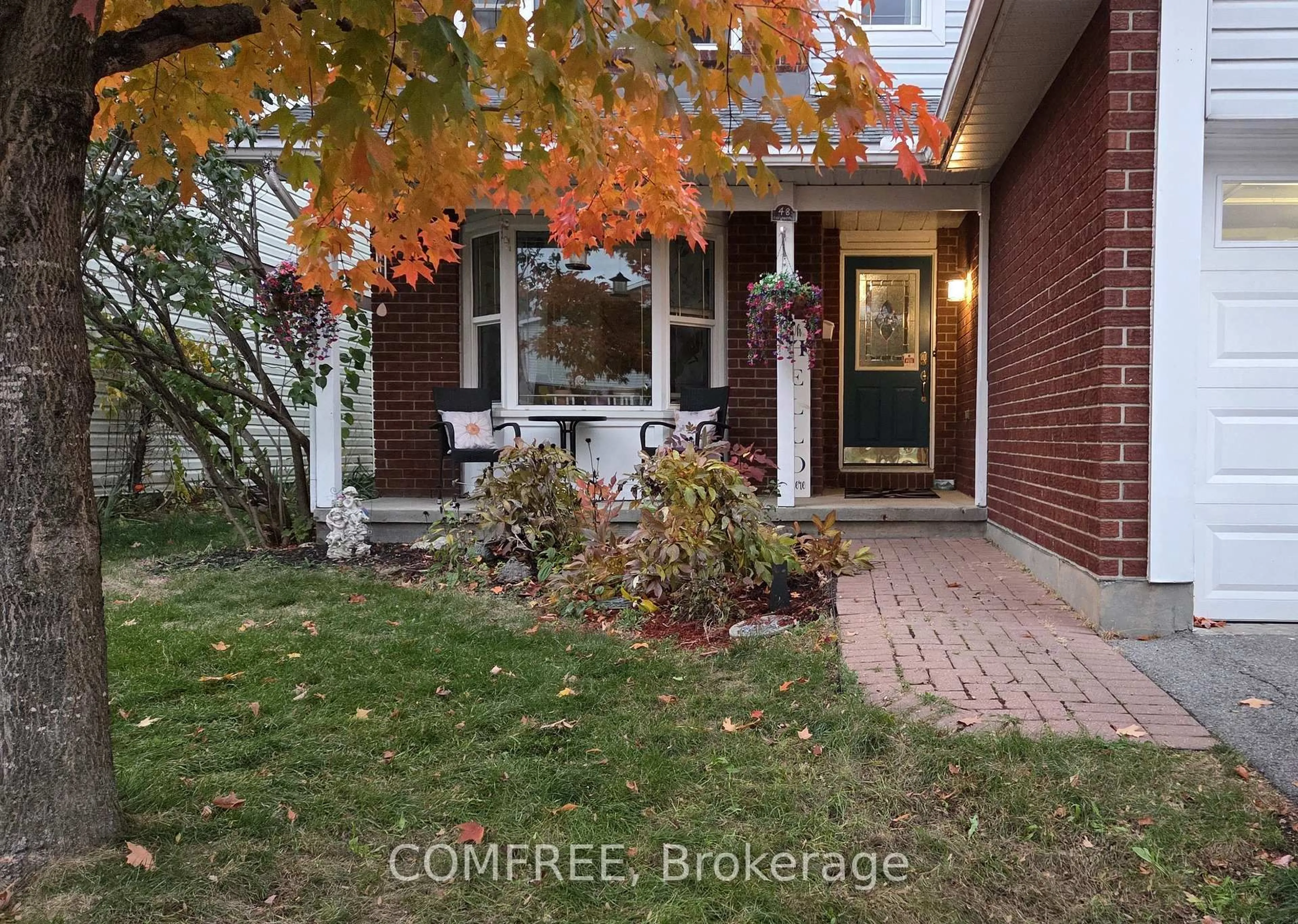 Home with brick exterior material, street for 48 Tartan Dr, Barrhaven Ontario K2J 2V5