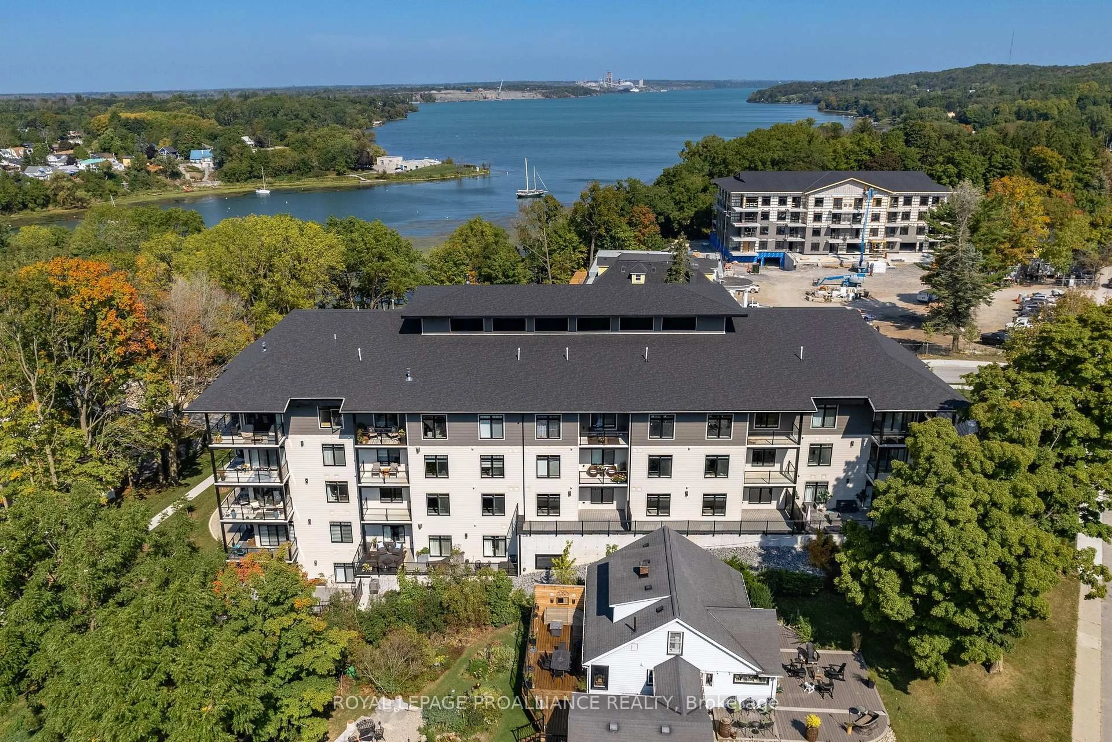 A pic from outside/outdoor area/front of a property/back of a property/a pic from drone, water/lake/river/ocean view for 17 Cleave Ave #409, Prince Edward County Ontario K0K 2T0