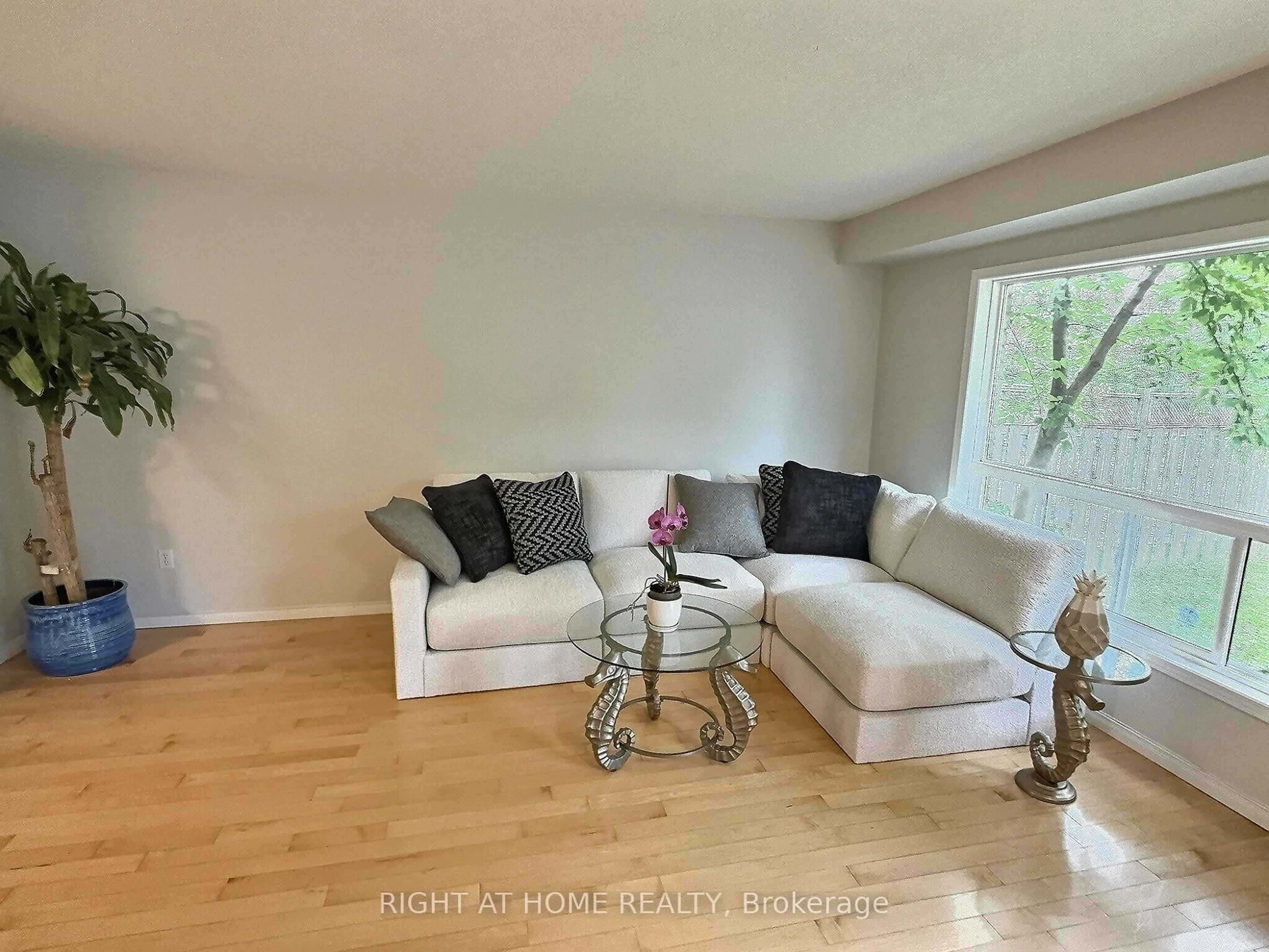Living room with furniture, wood/laminate floor for 385 Havendale Cres, Waterloo Ontario N2T 2T4