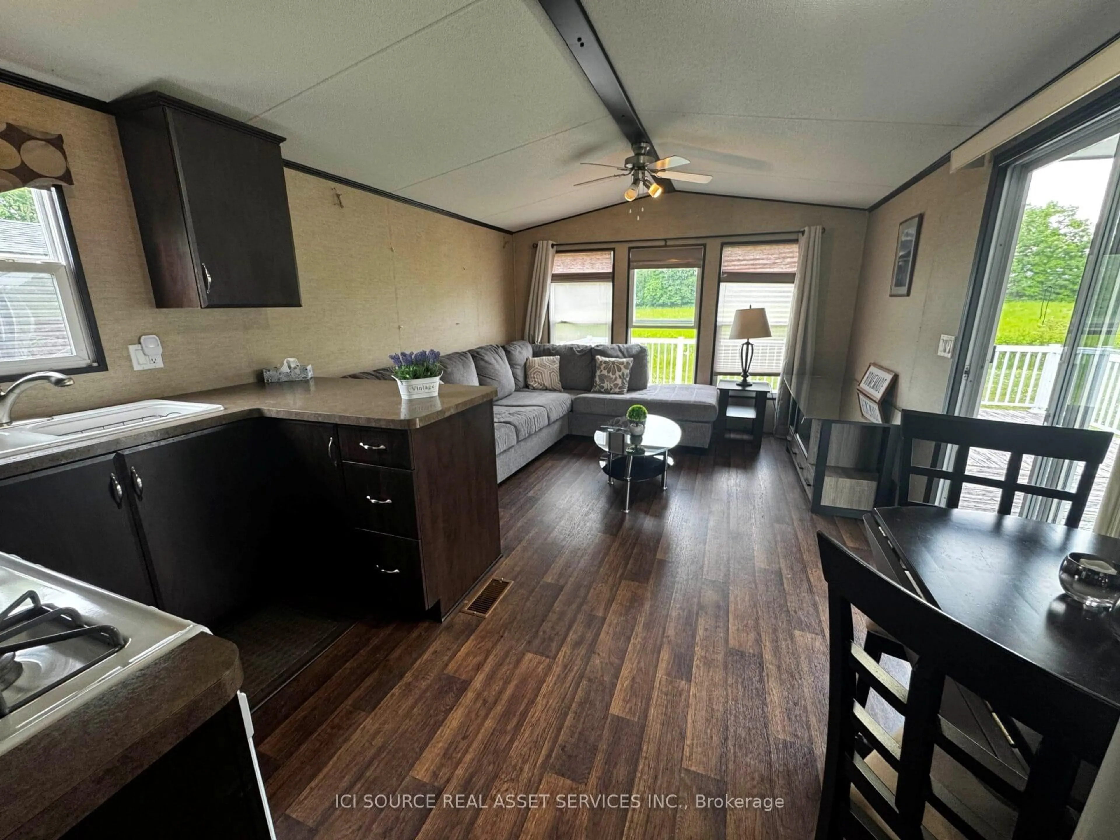 Open concept kitchen, wood/laminate floor for 1235 Villiers Line #LBA015, Otonabee-South Monaghan Ontario K0L 2G0