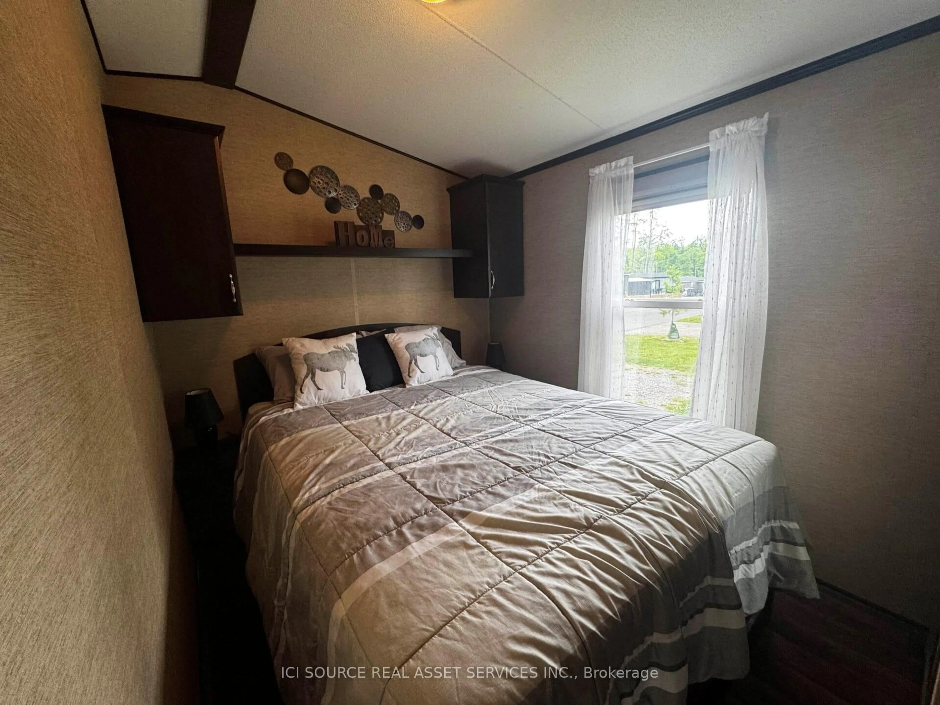 Bedroom with bed, wood/laminate floor for 1235 Villiers Line #LBA015, Otonabee-South Monaghan Ontario K0L 2G0
