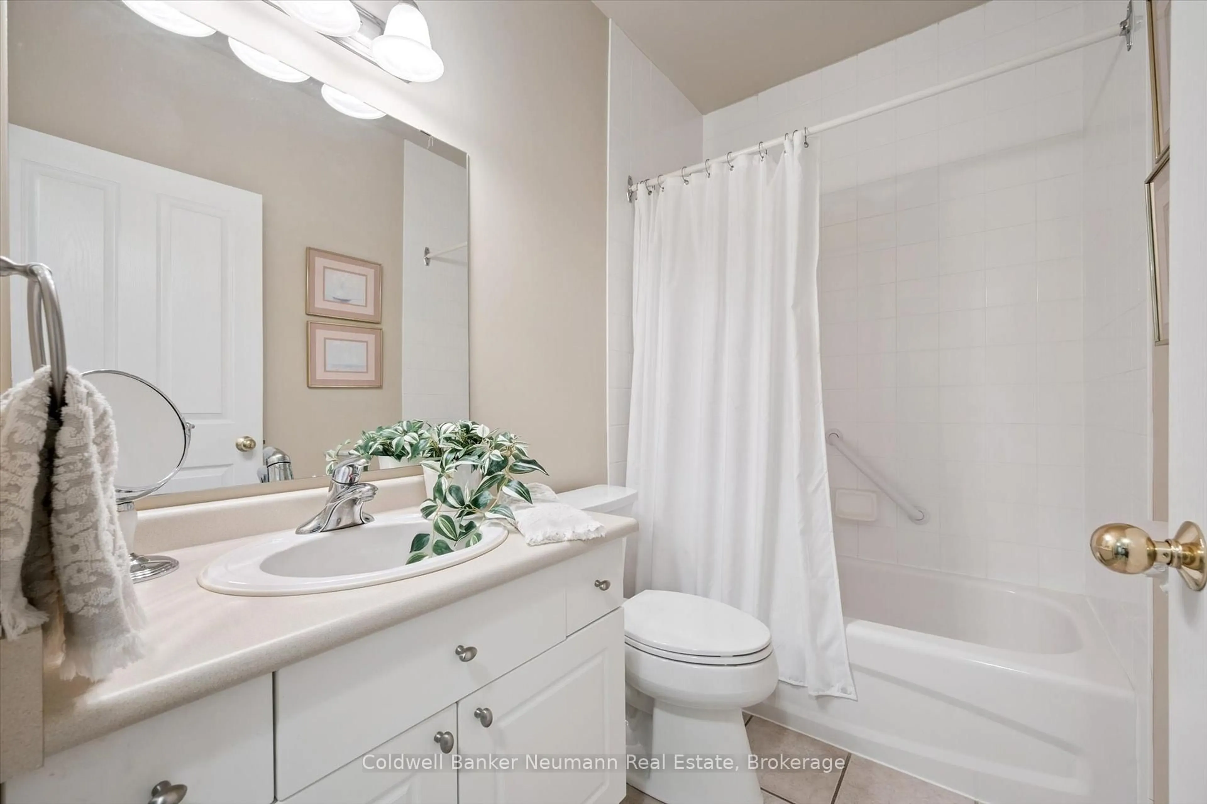 Standard bathroom, ceramic/tile floor for 60 Wyndham St #206, Guelph Ontario N1E 7H7