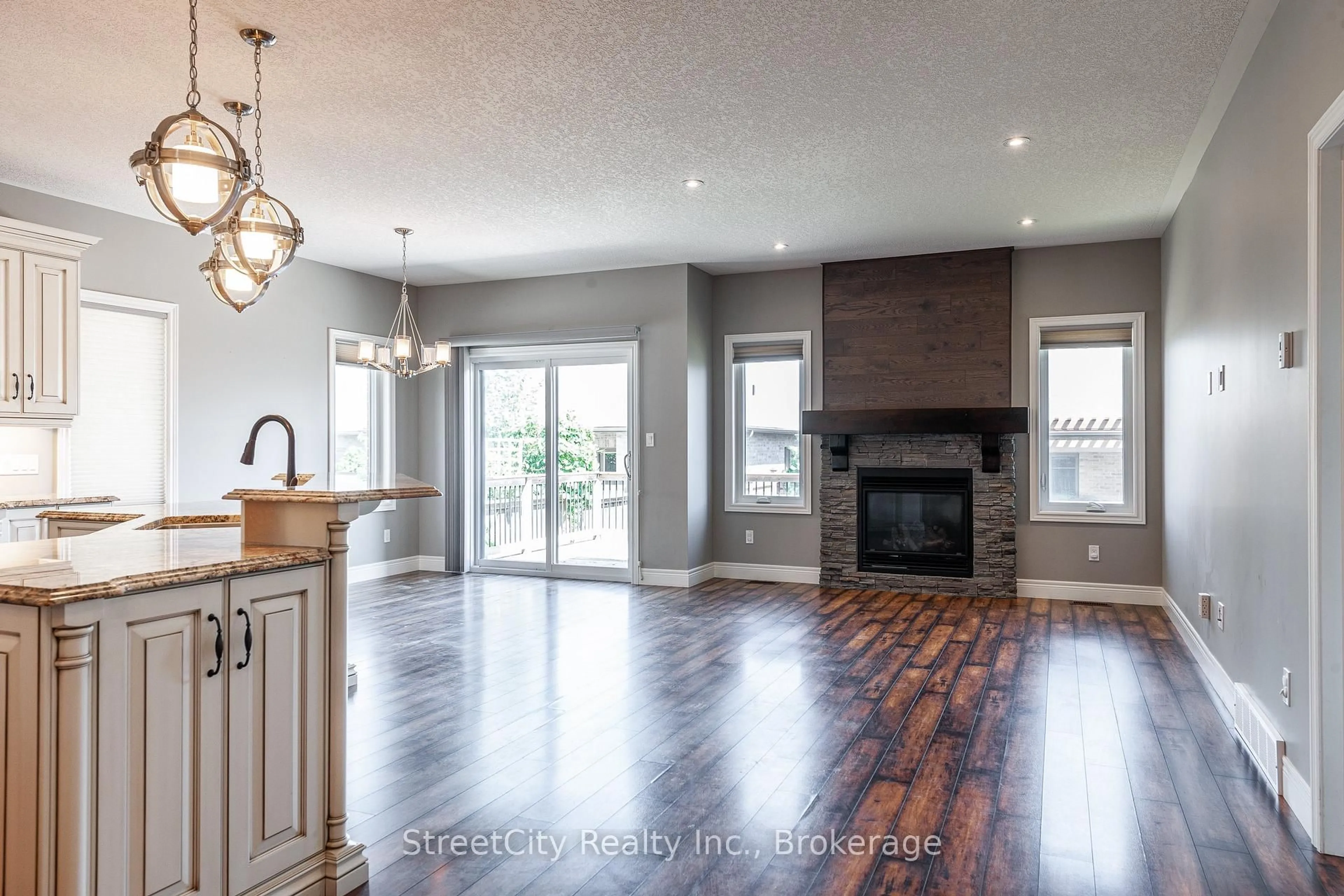 Open concept kitchen, wood/laminate floor for 670 Forman Ave, Stratford Ontario N5A 0G3