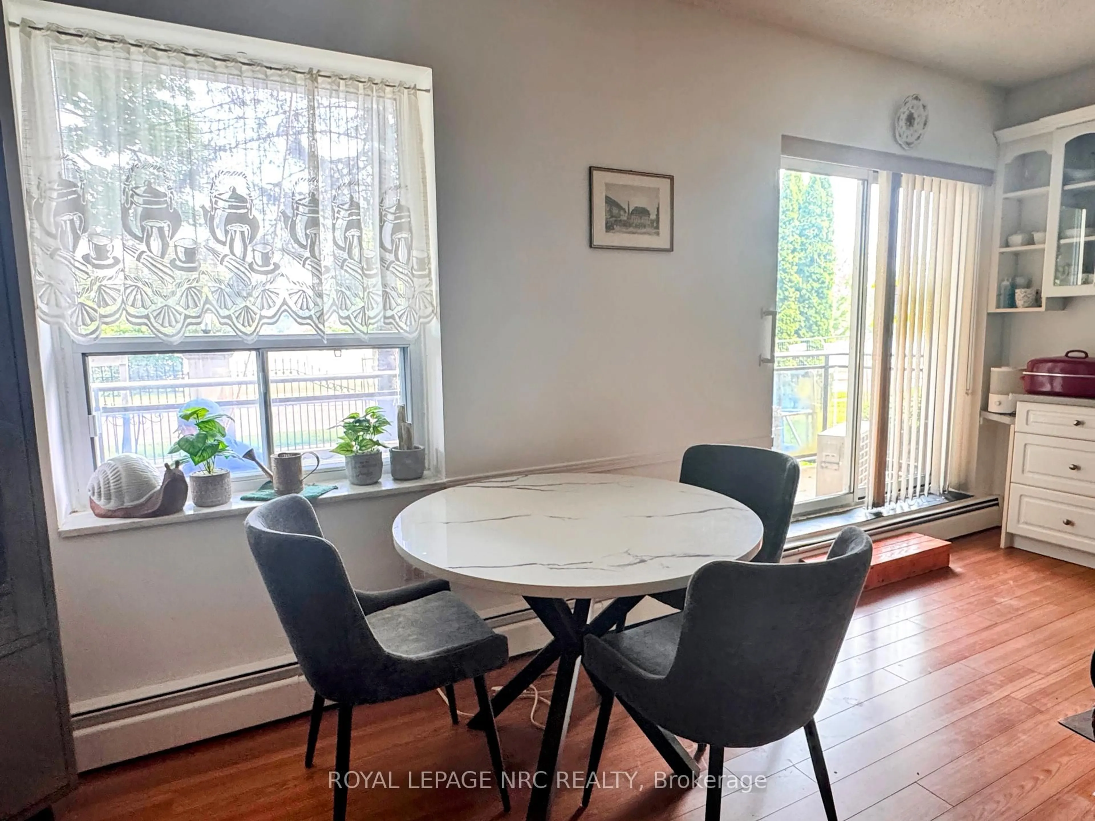 Dining room, wood/laminate floor for 6390 Huggins St #101, Niagara Falls Ontario L2J 1H1
