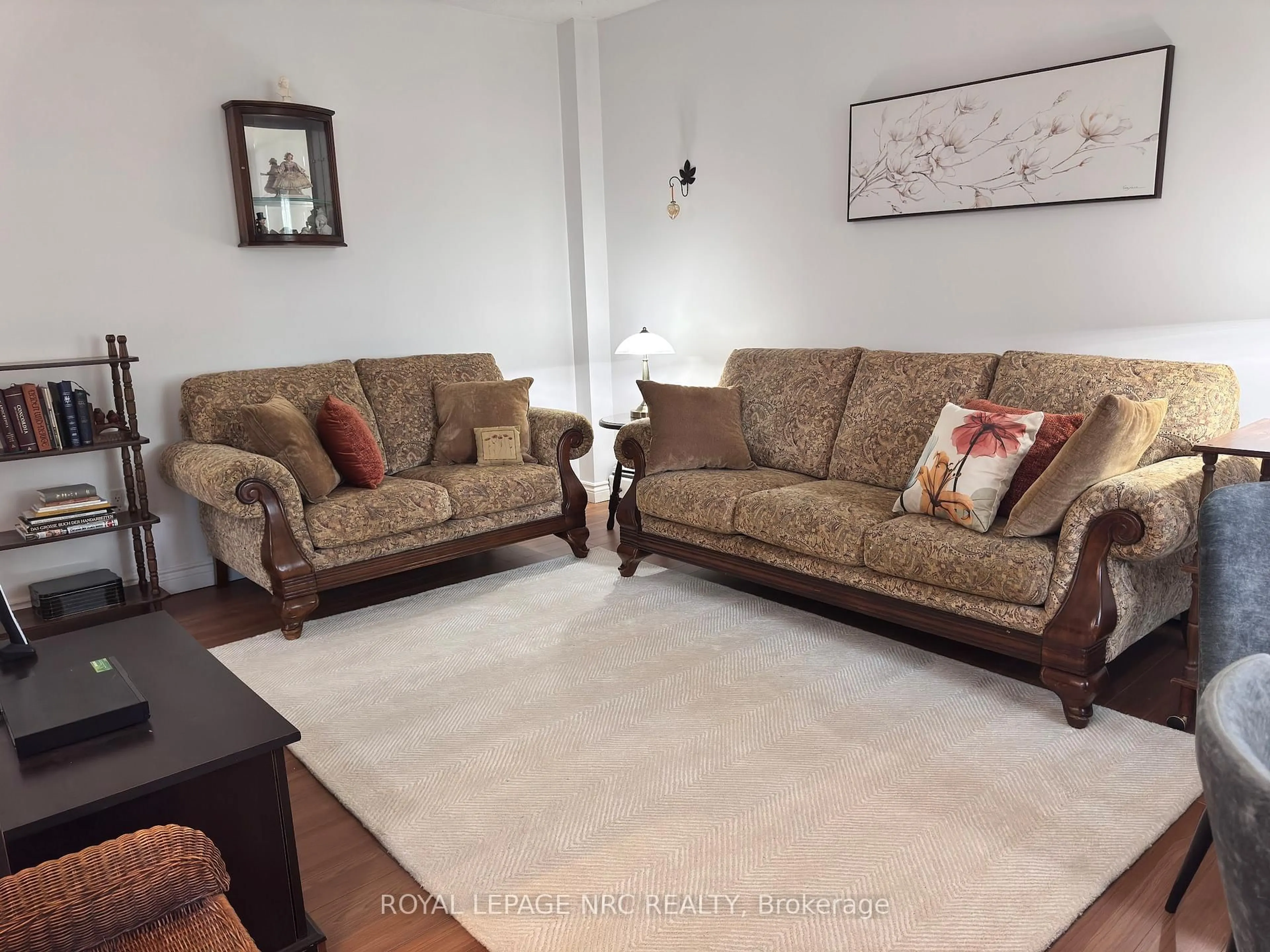 Living room with furniture, carpet floor for 6390 Huggins St #101, Niagara Falls Ontario L2J 1H1